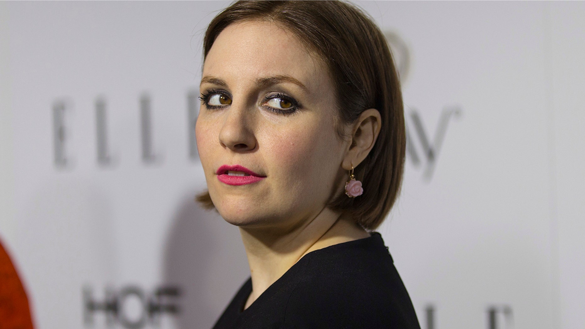 Actress Lena Dunham poses at Elle Magazine annual Women in Television dinner in Los Angeles, California January 13, 2015.