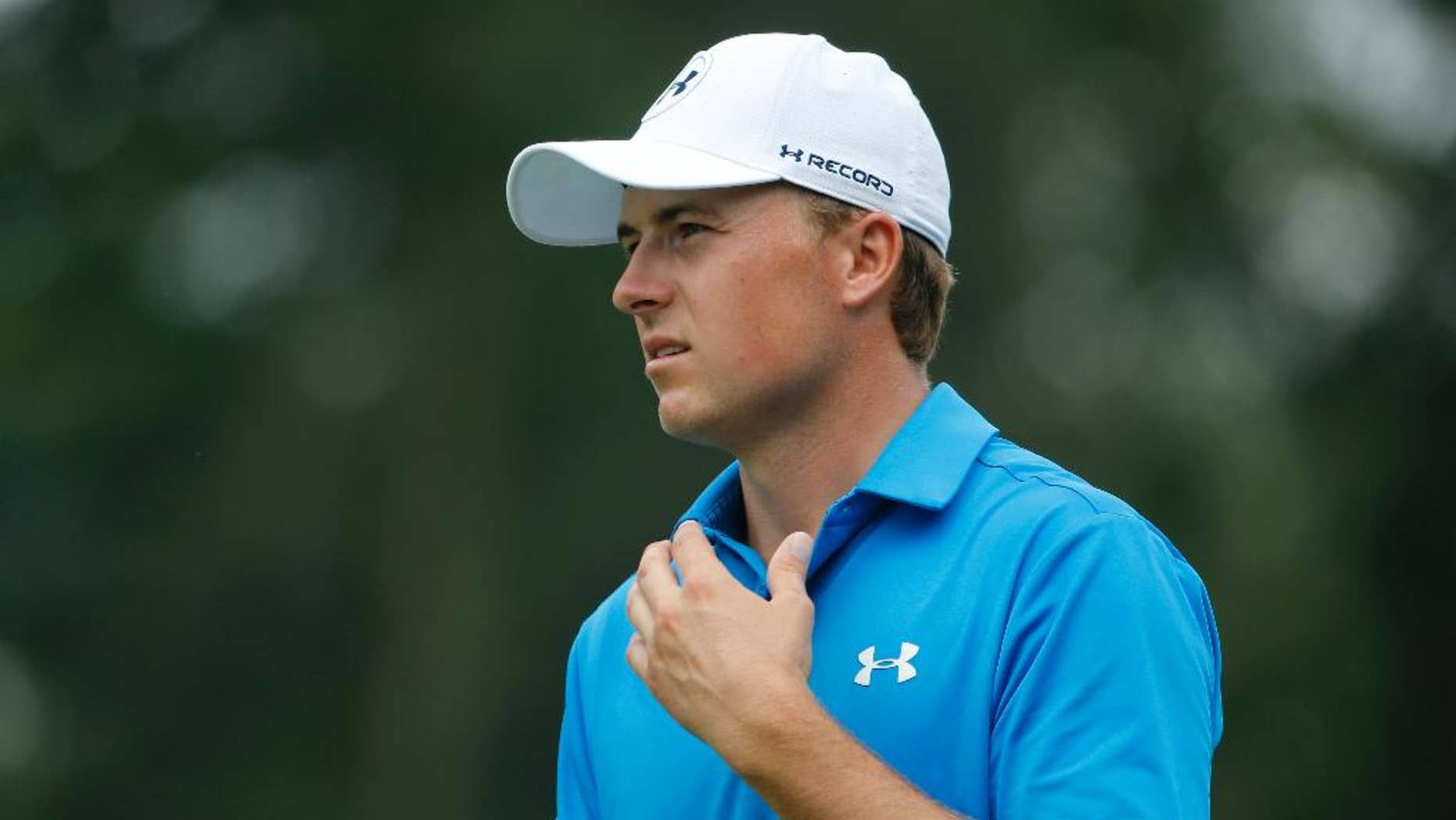FILE - In this July 29, 2016, file photo, Jordan Spieth watches his approach shot on the fifth hole during the second round of the PGA Championship golf tournament at Baltusrol Golf Club in Springfield, N.J. Spieth missed being part of the Olympics even before the golf began. Rory McIlroy thought it was a big hit and was thankful to be wrong. They were among the top four who chose not to go. (AP Photo/Mike Groll, File)
