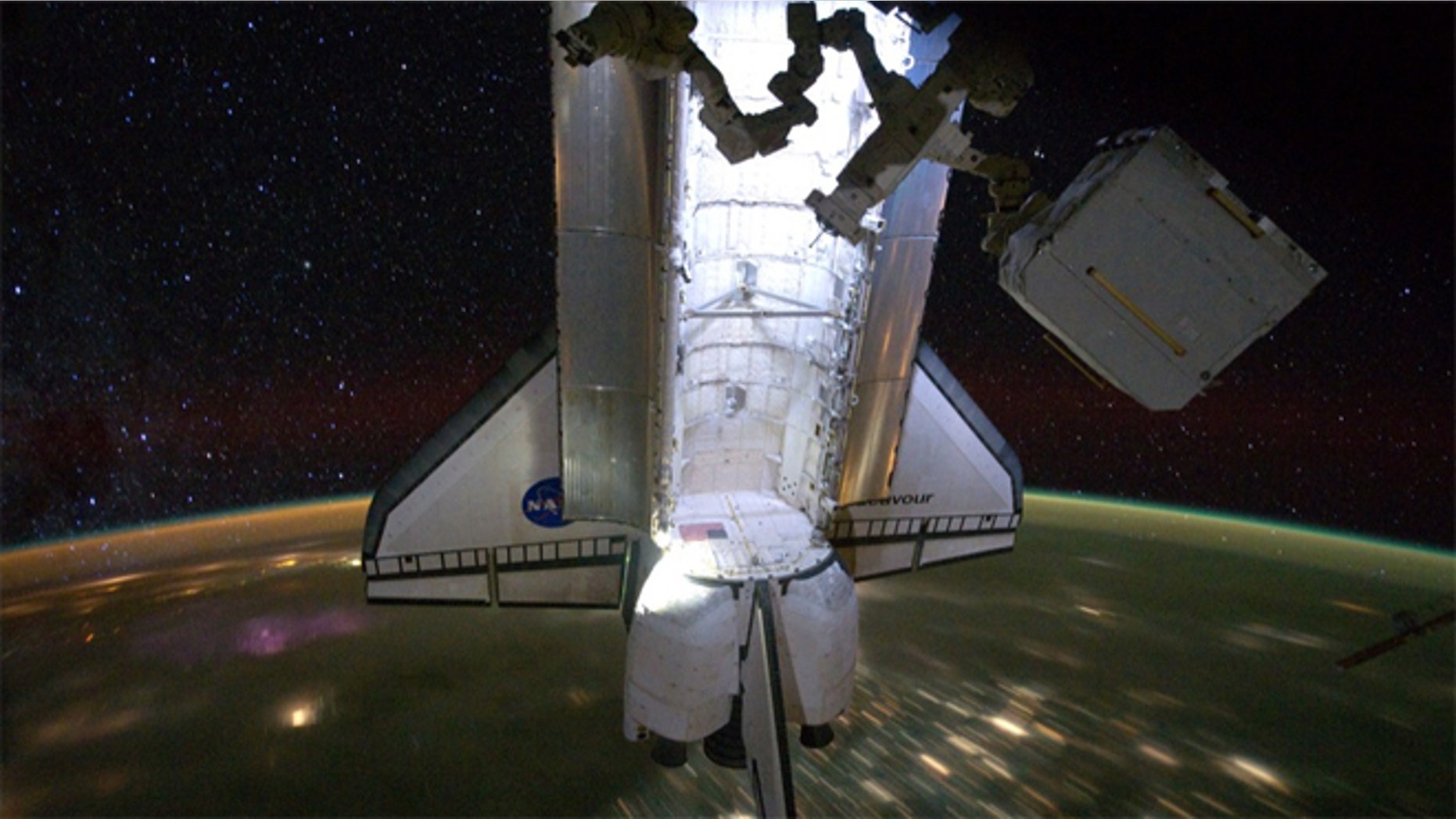 The $2 billion AMS experiment being removed from space shuttle Endeavour's cargo bay at the International Space Station.