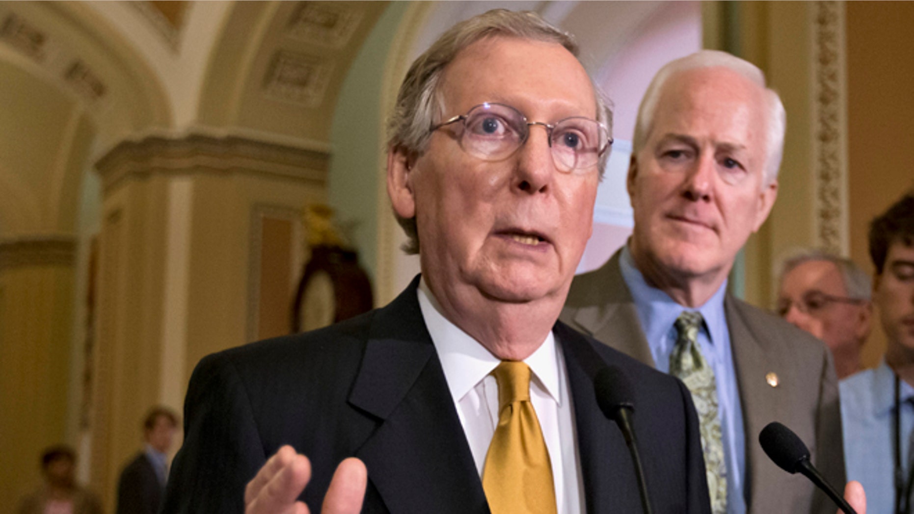 FILE: June 11, 2013: Then-Senate Minority Leader Mitch McConnell, R- Ky., left, and Minority Whip John Cornyn, R-Texas, speak with reporters on Capitol Hill, in Washington, D.C.