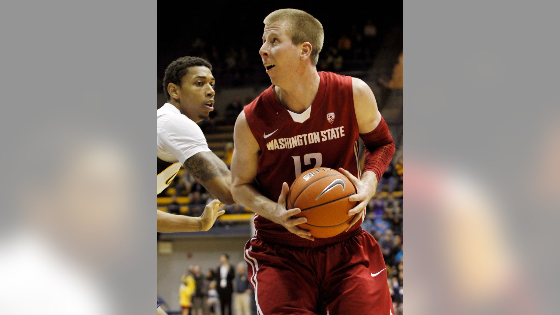 Washington State's Brock Motom, right, looks to shoot as California's Richard Solomon defends during the first half of an NCAA college basketball game, Saturday, Jan.12, 2013 in Berkeley, Calif. (AP Photo/George Nikitin)