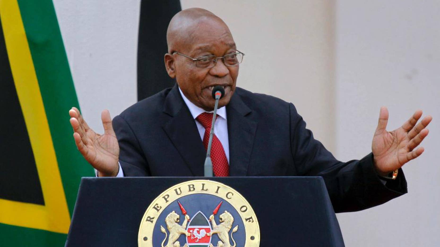 FILE -- In this Oct. 11, 2016, file photo, South African President Jacob Zuma gives a press conference at State House in Nairobi, Kenya. The head of South Africa’s state watchdog agency says she is delaying the release of a report on whether a wealthy business family linked to President Jacob Zuma sought to influence Cabinet minister appointments. (AP Photo/Khalil Senosi, File)
