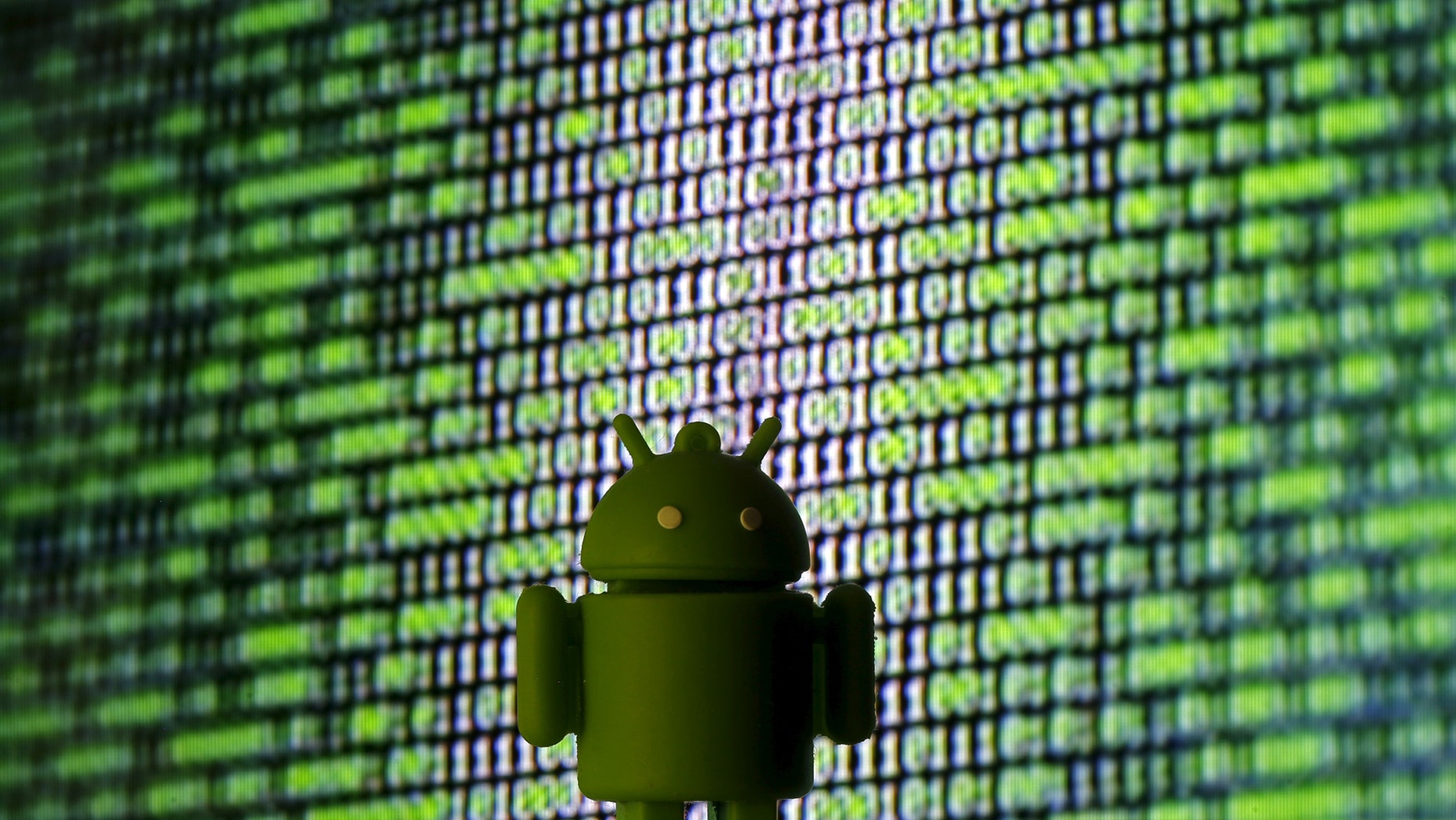 File photo - A 3D printed Android logo is seen in front of a displayed cyber code in this illustration taken March 22, 2016. (REUTERS/Dado Ruvic/Illustration)