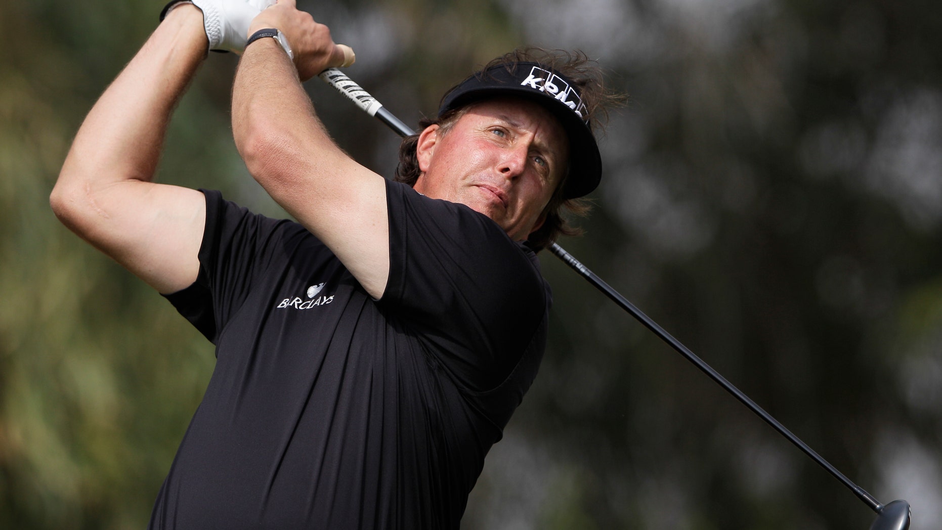 Phil Mickelson of the U.S. tees off on the 5th hole during the final round of the Abu Dhabi HSBC Golf Championship in Abu Dhabi, United Arab Emirates, Sunday Jan. 19, 2014. (AP Photo/Kamran Jebreili)