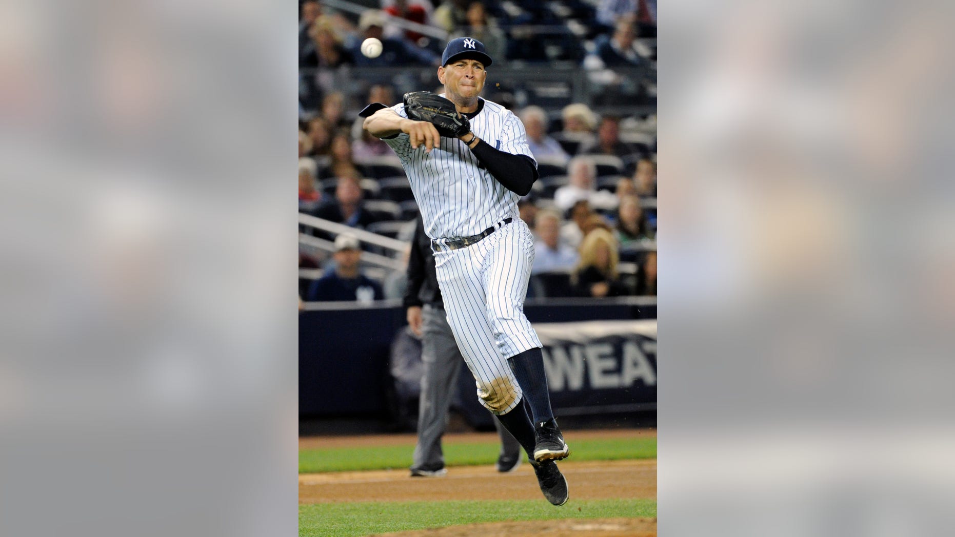 FILE - In this Sept. 6, 2013 file photo, New York Yankees third baseman Alex Rodriguez throws Boston Red Sox runner Dustin Pedroia during the fifth inning of a baseball game at Yankee Stadium in New York. Rodriguez's drug suspension has been cut to 162 games from 211 by arbitrator Fredric Horowitz, a decision sidelining the New York Yankees third baseman the entire 2014 season. (AP Photo/Bill Kostroun)