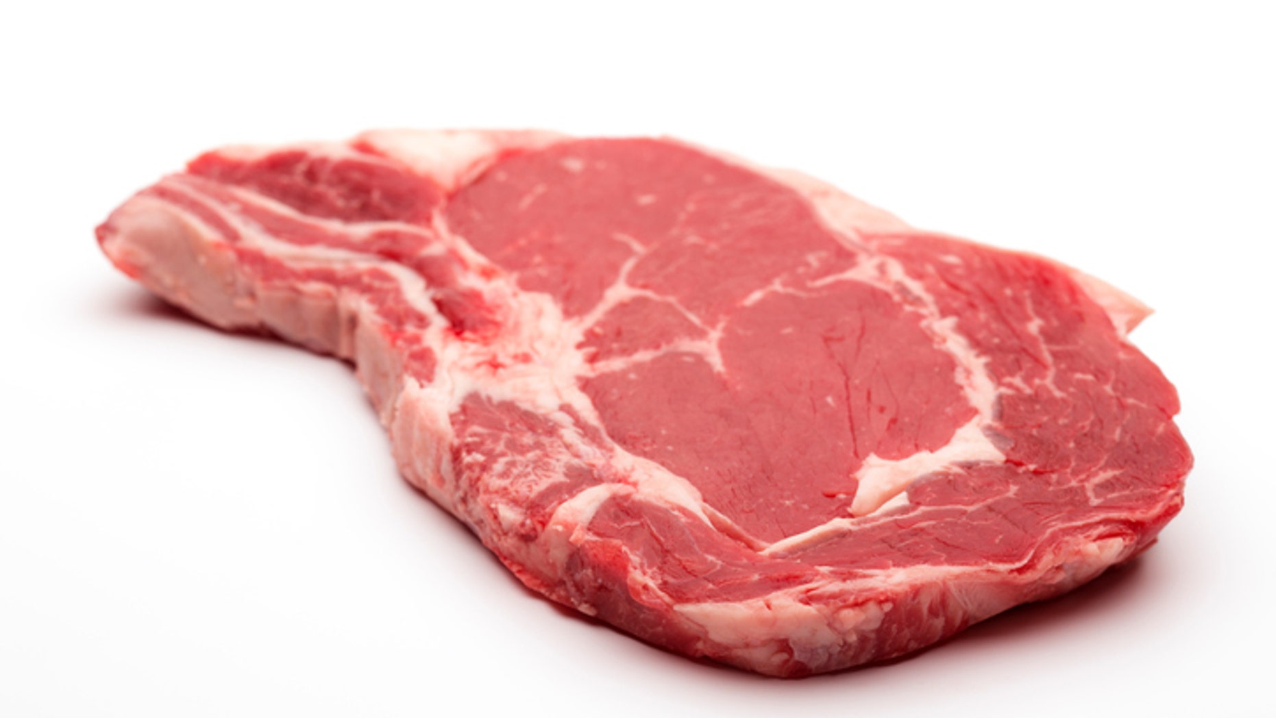 Rib eye on the bone Steak beef meat raw on white