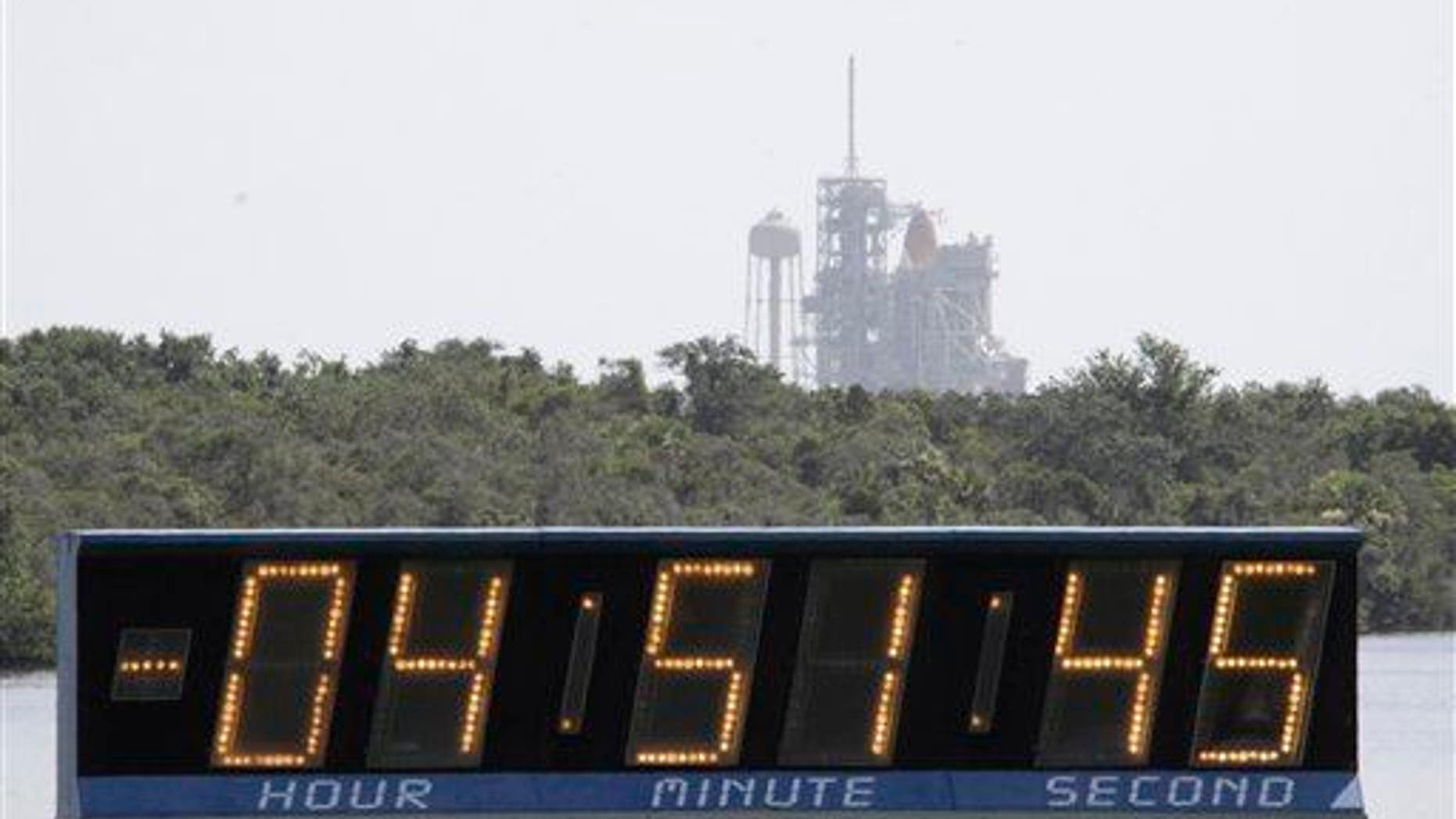 The countdown clock continues to click as the space shuttle Endeavour sits at the Kennedy Space Center at Cape Canaveral, Fla., on July 12, 2009.