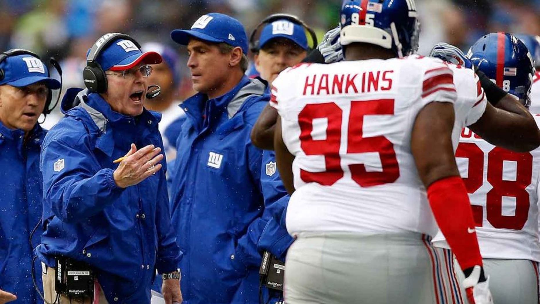 SEATTLE, WA - NOVEMBER 09: Head coach Tom Coughlin of the New York Giants yells at defensive tackle Johnathan Hankins #95 of the New York Giants as he comes off the field during the first quarter of the game against the Seattle Seahawks at CenturyLink Field on November 9, 2014 in Seattle, Washington. (Photo by Otto Greule Jr/Getty Images)