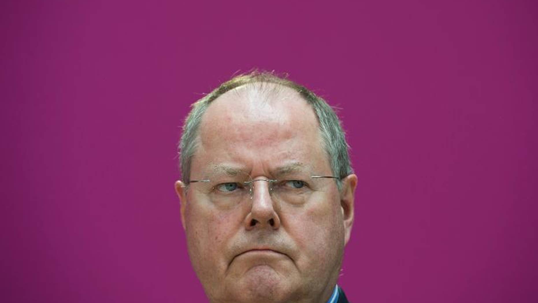 Peer Steinbrueck, candidate for chancellor of Germany's social democratic SPD party, addresses a press conference to present members of his competence team on May 13, 2013 in Berlin.