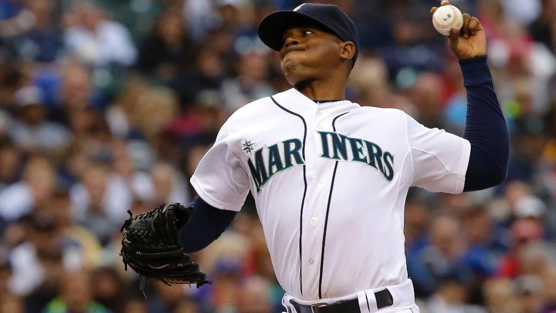 Seattle Mariners starting pitcher Roenis Elias kicks throws against the Washington Nationals during the fourth inning of a baseball game, Saturday, Aug. 30, 2014, in Seattle. (AP Photo/Ted S. Warren)