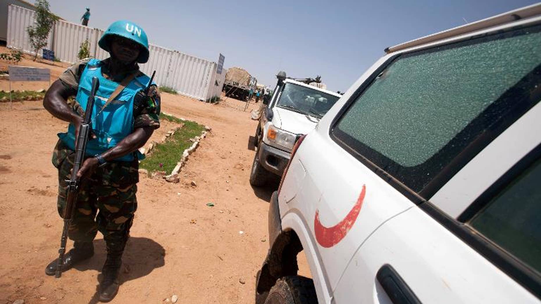 A handout picture released by UNAMID on July 14, 2013 shows a peacekeeper in South Darfur