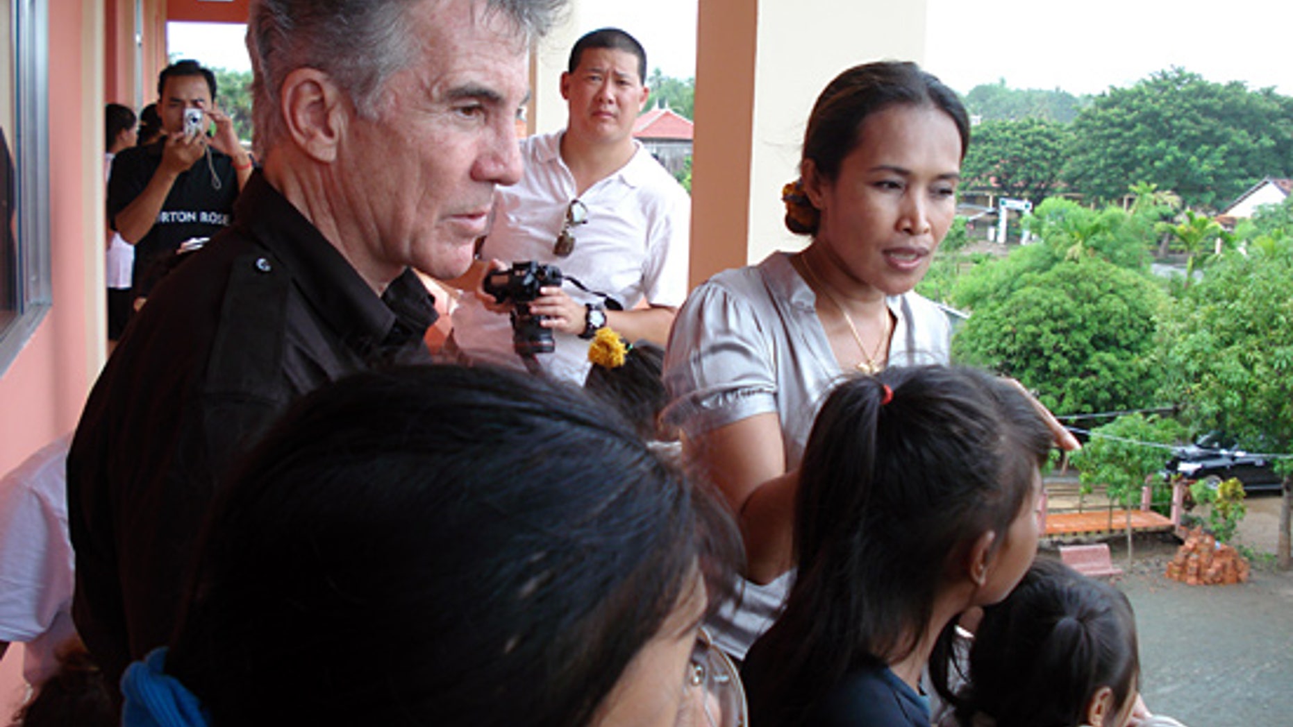 John Walsh and child rescuer Somaly Mam. (FOX/AMW)