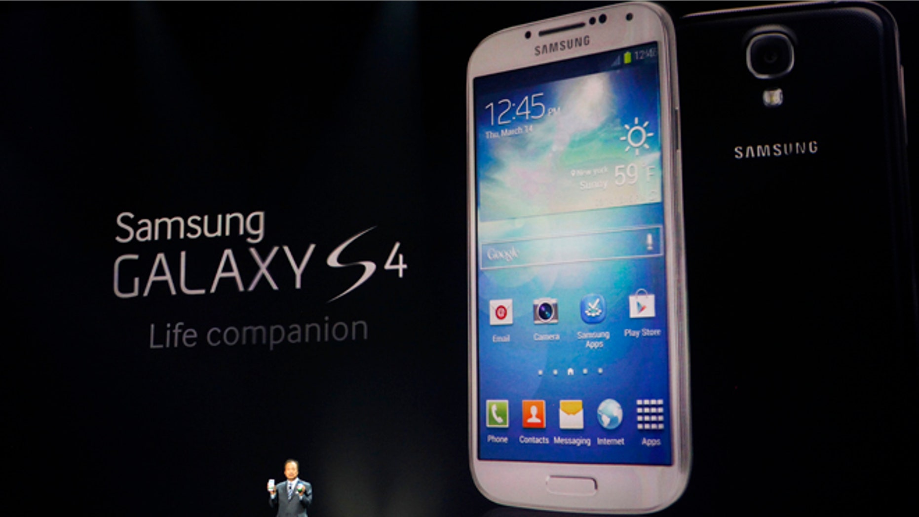 JK Shin, President and Head of IT and Mobile Communications for Samsung Electronics, presents the new Samsung Galaxy S 4 during the Samsung Unpacked event at Radio City Music Hall, Thursday, March 14, 2013 in New York. (AP Photo/Jason DeCrow)