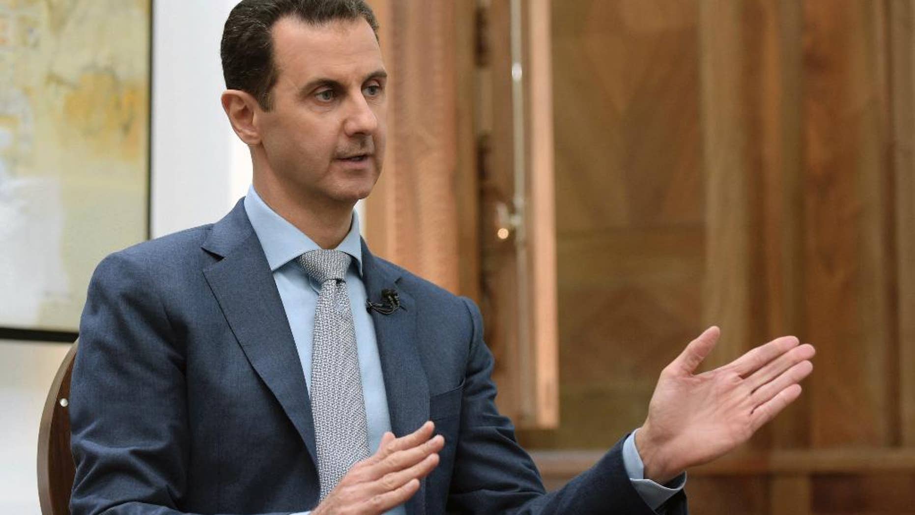 FILE - In this Feb. 10, 2017 file photo released by the Syrian official news agency SANA, Syrian President Bashar Assad speaks during an interview with Yahoo News in Damascus, Syria. Though still evolving, President Donald Trump’s plans for Syria have come into clearer view since he ordered cruise missiles on a Syrian air base to punish Assad for a chemical weapons attack. Assad has violently resisted all attempts to end his rule, fueling a conflict that has killed as many as a half-million people. (SANA via AP, File)