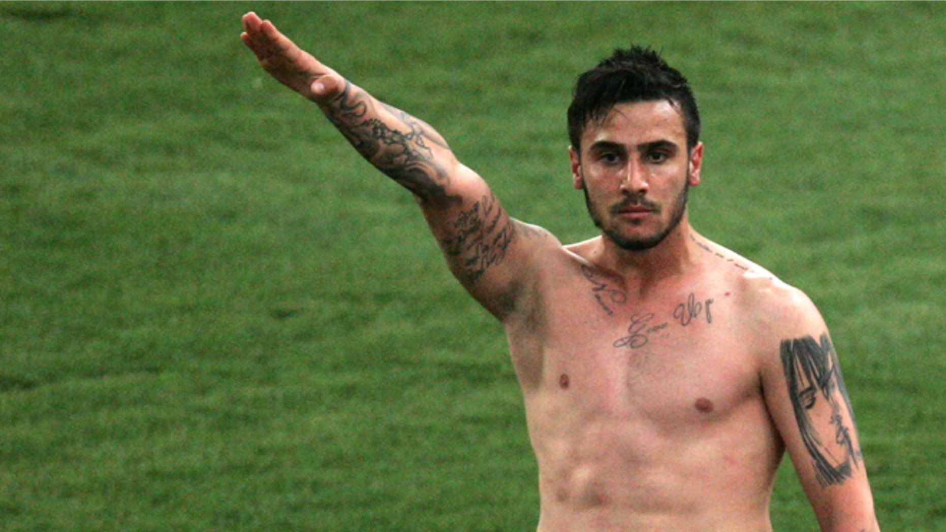 March 16, 2013: AEK Athens midfielder Giorgos Katidis raises his hand in a Nazi style salute as he celebrates scoring the winner in a Greek league gaame against Veria in Athens' Olympic Stadium.