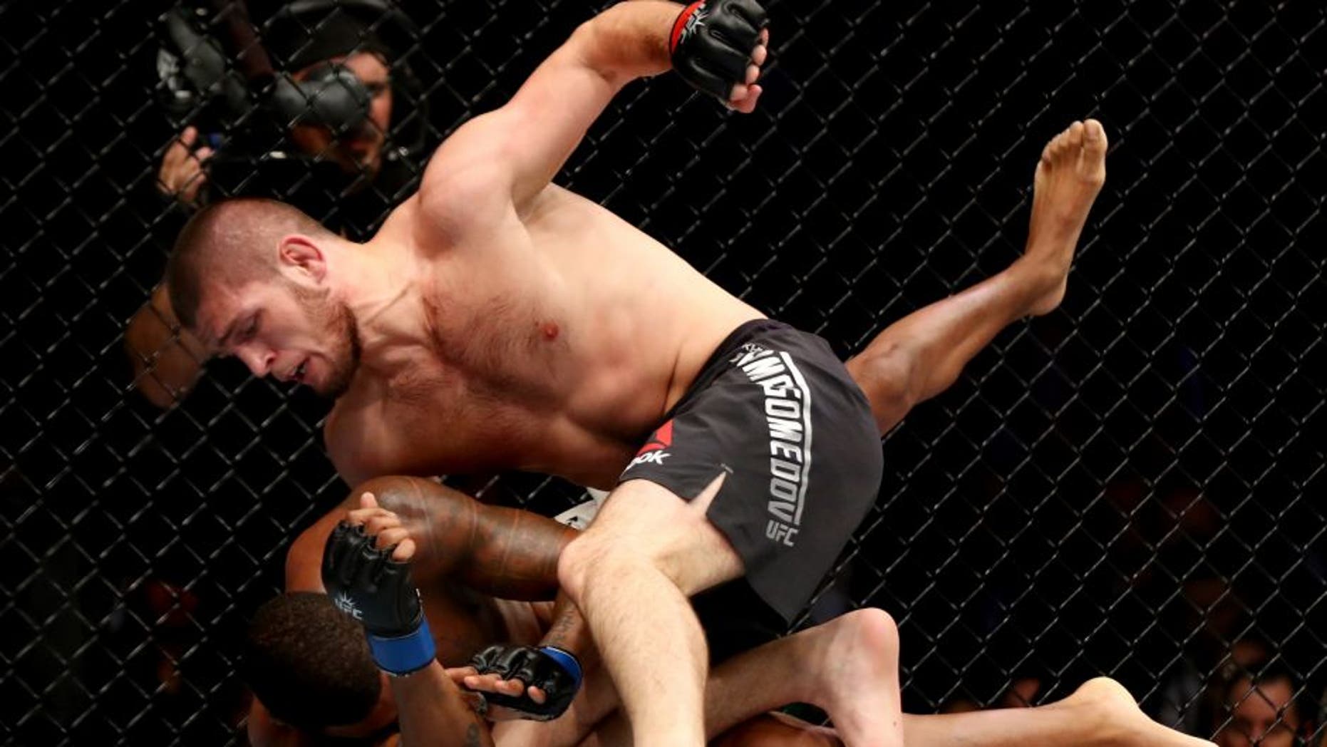 NEW YORK, NY - NOVEMBER 12: Khabib Nurmagomedov of Russia (top) fights against Michael Johnson of the United States in their lightweight bout during the UFC 205 event at Madison Square Garden on November 12, 2016 in New York City. (Photo by Al Bello/Zuffa LLC/Zuffa LLC via Getty Images)