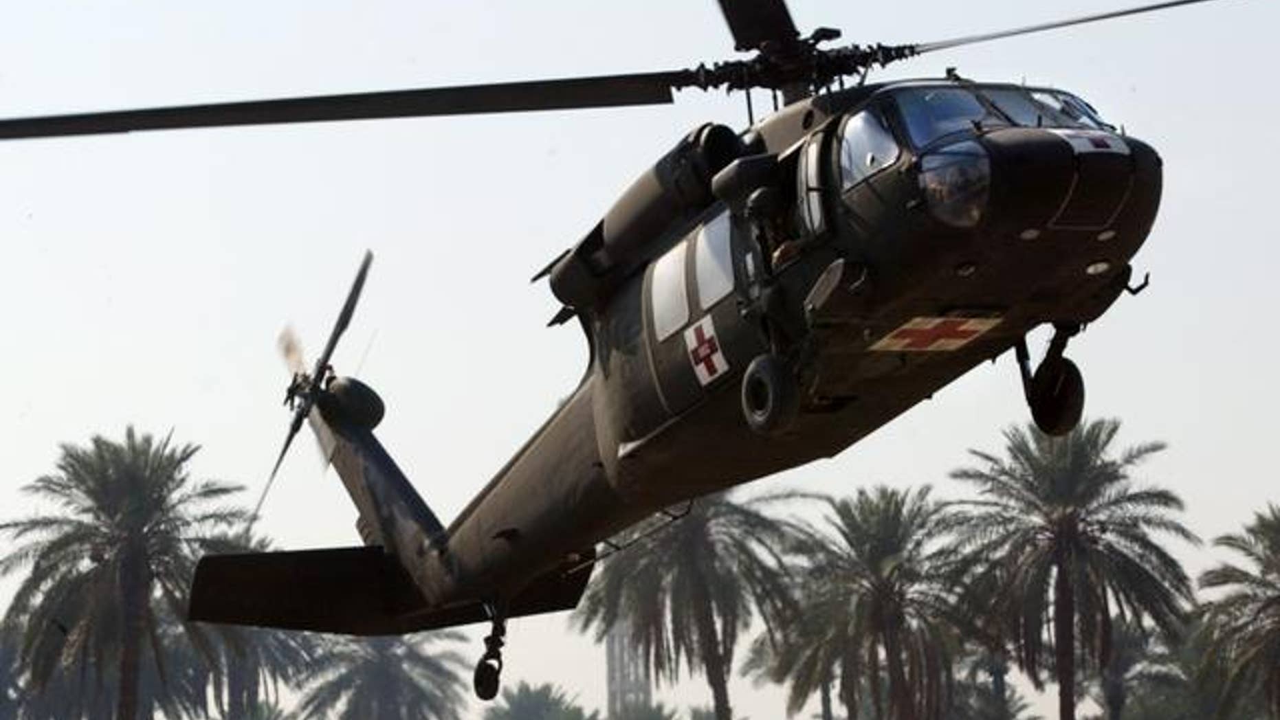 A U.S. Army Blackhawk medevac helicopter arrives with wounded soldiers at the 31st Combat Support Hospital in Baghdad, Iraq Tuesday, Nov. 9, 2004. (AP Photo/John Moore)