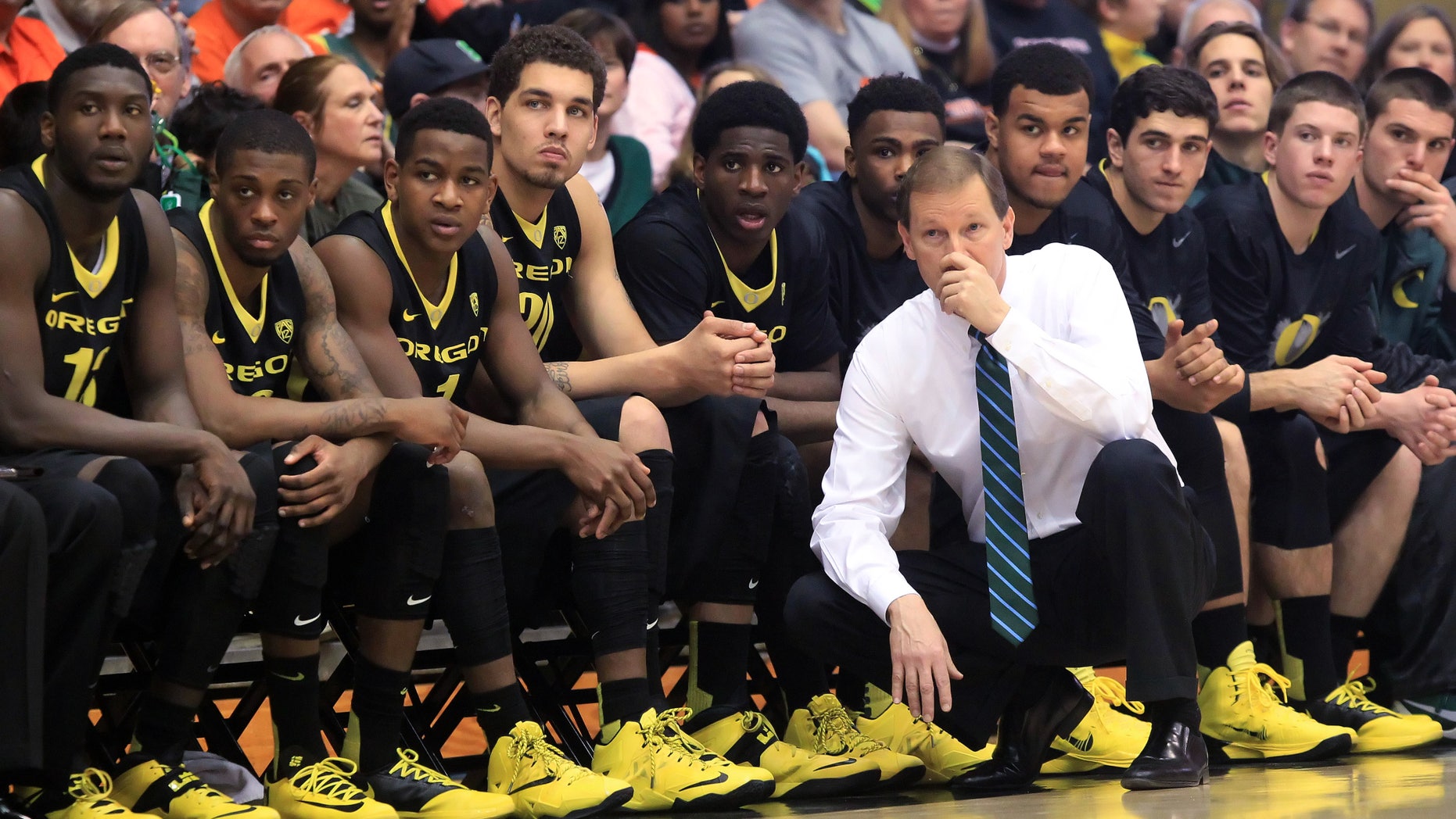 Oregon head coach Dana Altman and the bench watch as the Oregon State take a double-digit lead during an NCAA men's basketball game at Gill Coliseum in Corvallis, Ore. on Sunday, Jan. 19, 2014. Oregon lost 80-72 to Oregon State. (AP Photo/The Register-Guard, Brian Davies)