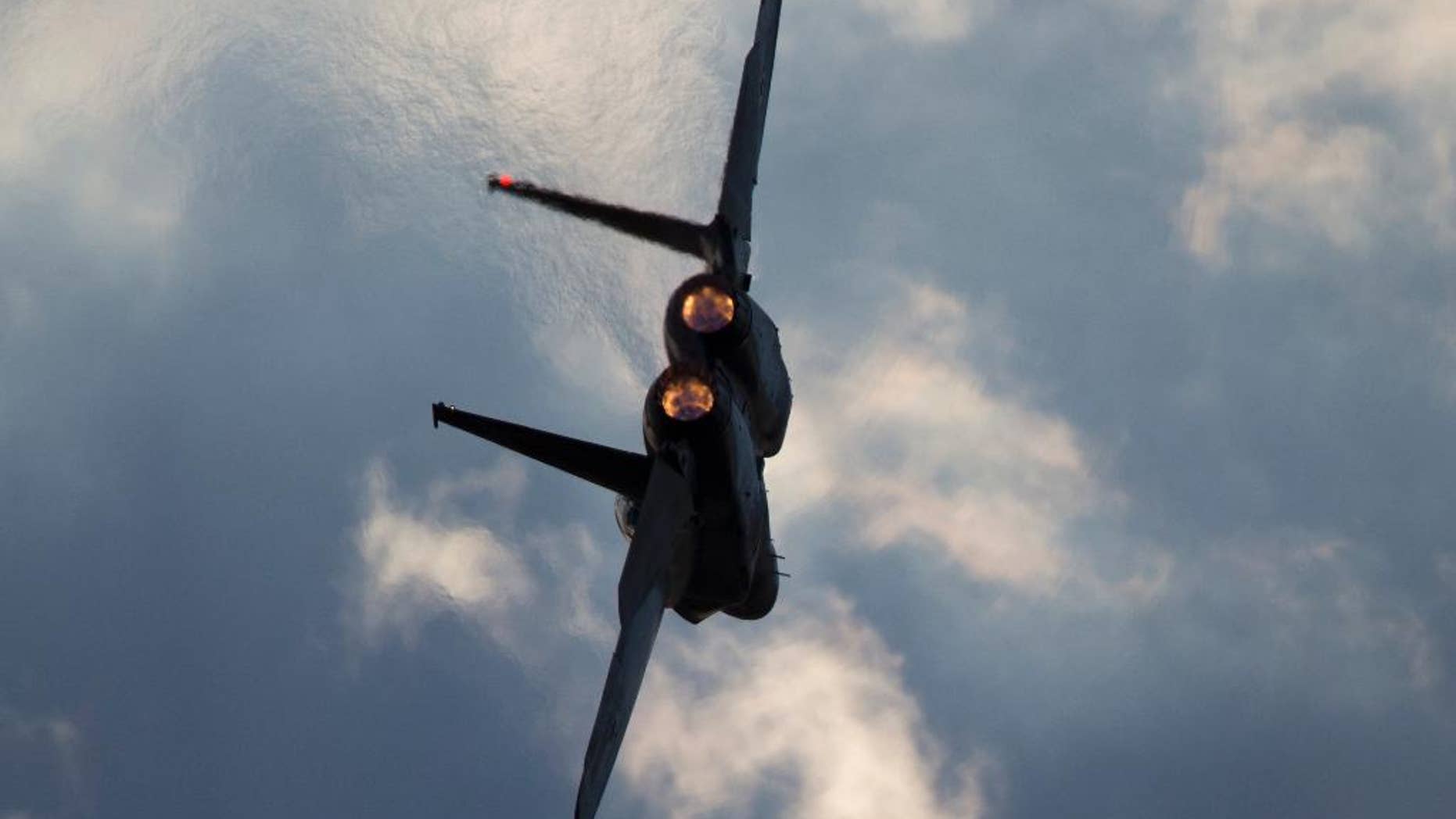 This Thursday, Dec. 29, 2016 photo shows an Israeli Air Force F-15 plane in flight during a graduation ceremony for new pilots in the Hatzerim air force base near the city of Beersheba, Israel. Anti-aircraft missiles were launched from Syria into Israeli-controlled territory early on Friday, following a series of Israeli airstrikes inside Syria, the Israeli military said. The military said its warplanes struck several targets in Syria and were back in Israeli-controlled airspace when several anti-aircraft missiles were launched from Syria toward the Israeli jets. (AP Photo/Ariel Schalit)