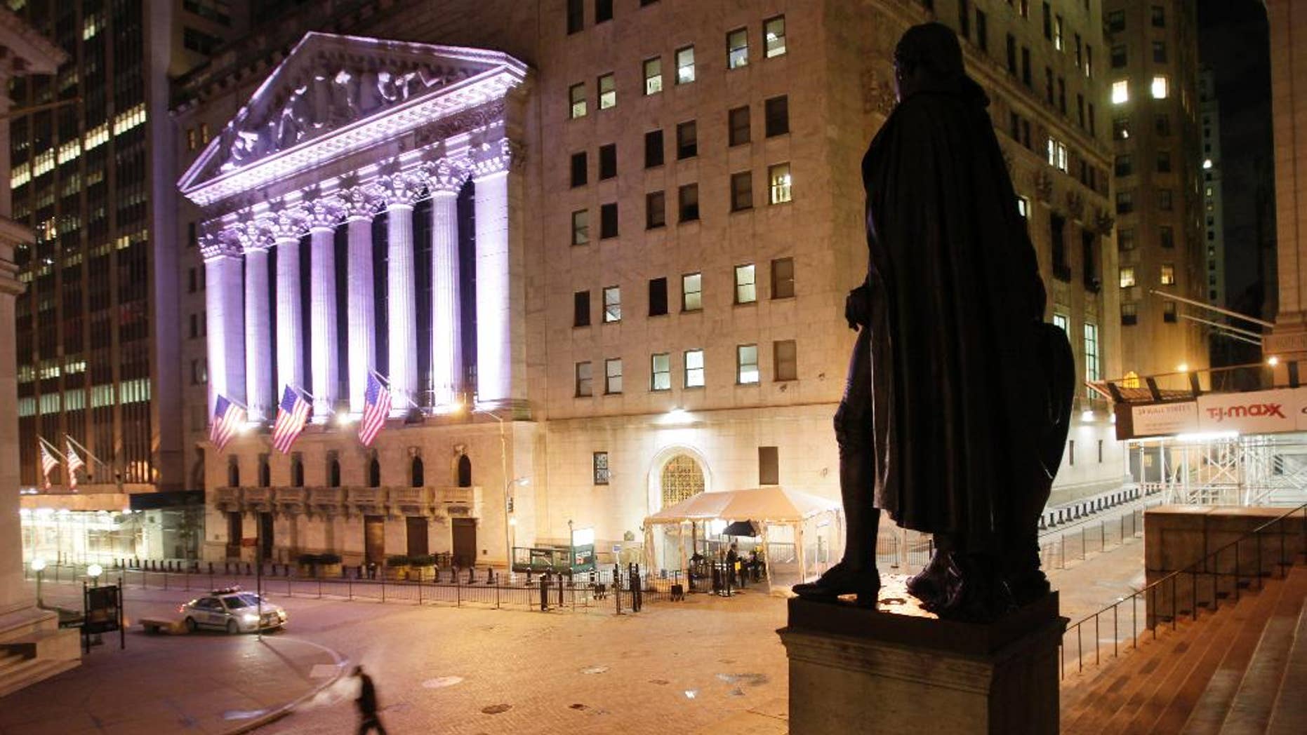 A statue of George Washington stands near The New York Stock Exchange, background, Wednesday, Oct. 8, 2014 in New York. World stock markets mostly retreated Thursday Nov. 6, 2014 as investors awaited a European Central Bank policy meeting and a U.S. jobs report that might deliver a verdict on whether the Federal Reserve's withdrawal of stimulus was warranted. (AP Photo/Mark Lennihan)