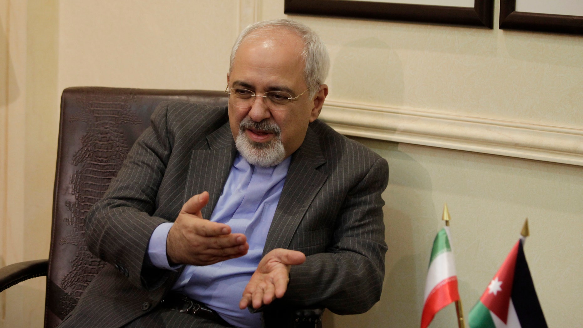 Iranian Foreign Minister Mohammad Javad Zarif meets with his Jordanian counterpart Nasser Judeh in Amman, Jordan, Tuesday, Jan. 14, 2014. Zarif visits Jordan as part of his regional tour of the Middle East countries including Iraq, Kuwait, Lebanon, Oman, Qatar and United Arab Emirates. (AP Photo/Mohammad Hannon, Pool)