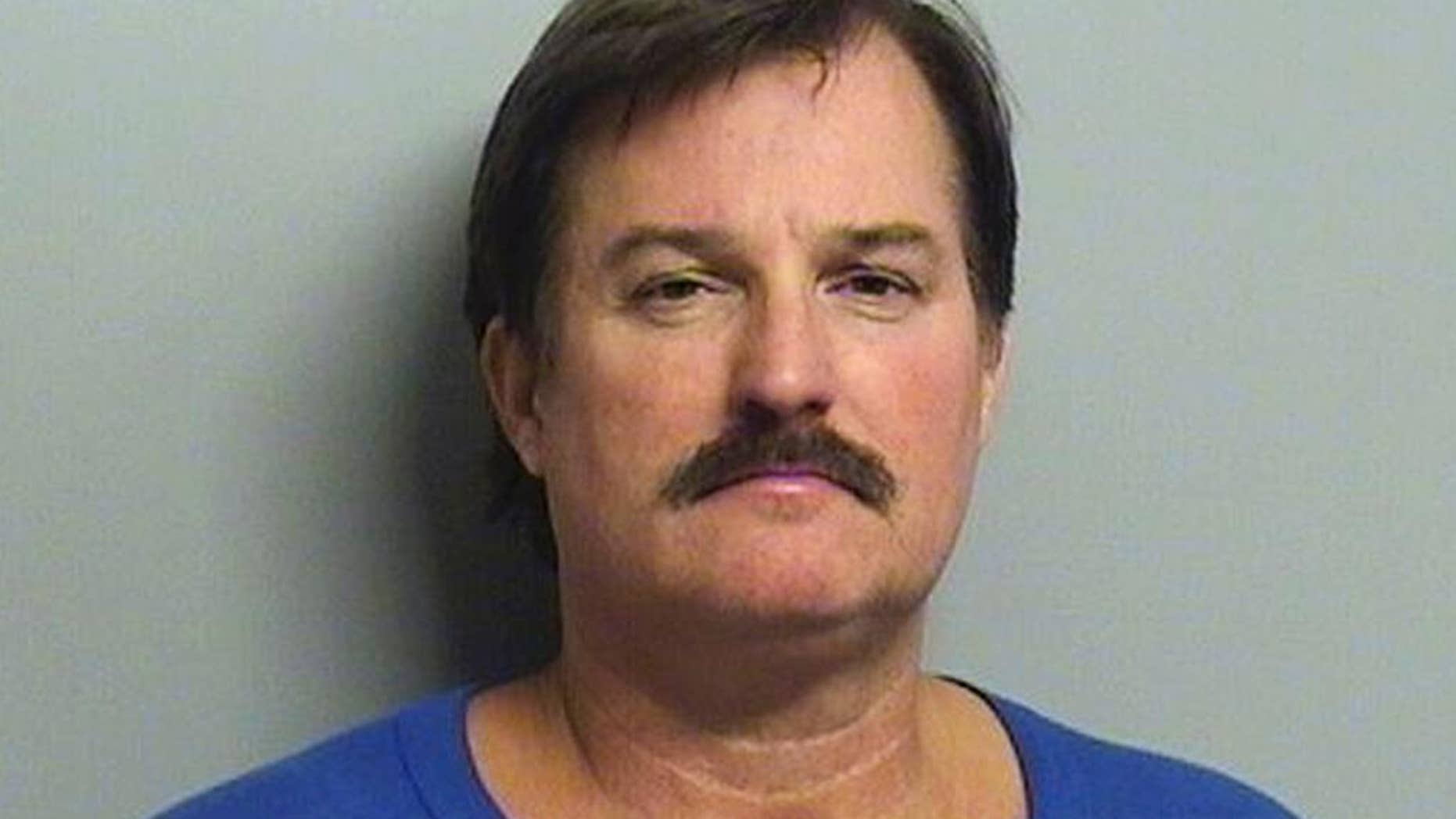 FILE - This undated file booking photo provided by the Tulsa County Sheriff's Office shows Shannon Kepler. On Friday, Nov. 11, 2016, a judge declared a mistrial after jurors couldn't agree whether to convict Kepler, a former Tulsa police officer, of first-degree murder in the 2014 fatal shooting of his daughter's boyfriend. (Tulsa County Sheriff's Office via AP, File)