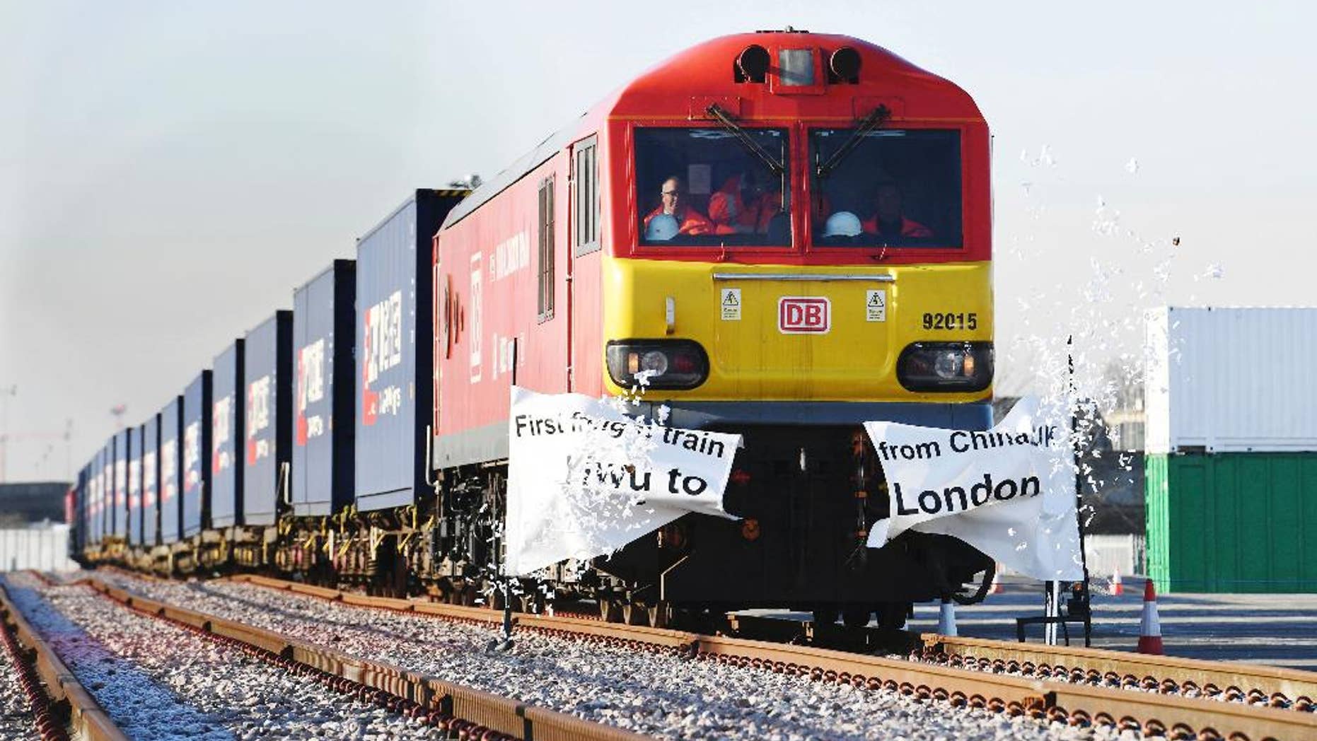 The first direct freight train service from China to the United Kingdom arrives at a rail freight terminal in Barking, east London, Wednesday Jan. 18, 2017. Some 34 containers packed with mainly clothes and other high street goods completed the 7,456-mile (11,999km) journey in 18 days. (Stefan Rousseau/PA via AP)