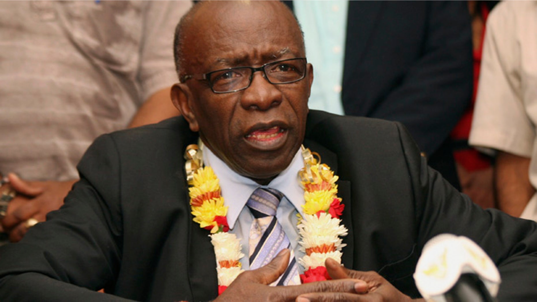 In this Thursday, June 2, 2011 file photo, suspended FIFA executive Jack Warner gestures during a news conference held shortly after his arrival at the airport in Port-of-Spain, in his native Trinidad and Tobago.