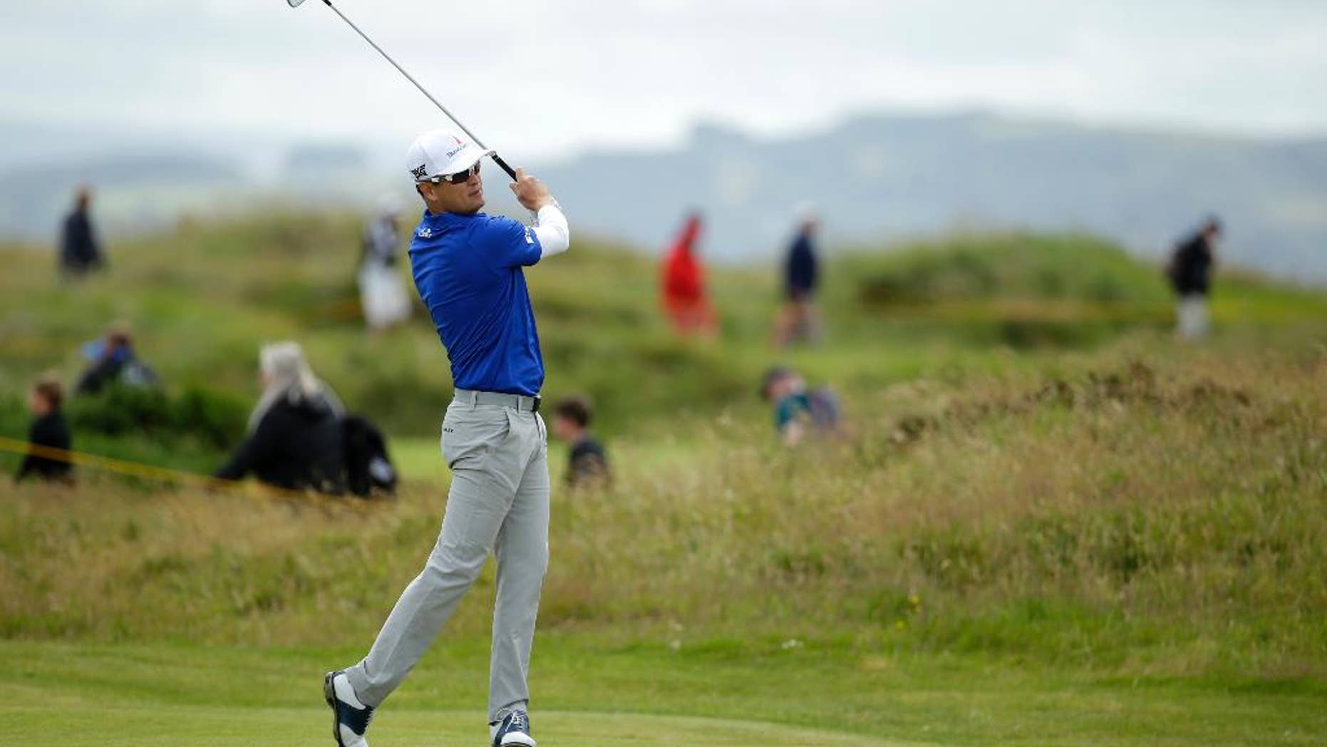 Zach Johnson of the United States plays the 15th fairway during a practice round ahead of the British Open Golf Championship at the Royal Troon Golf Club in Troon, Scotland, Wednesday, July 13, 2016.The British Open starts Thursday. (AP Photo/Matt Dunham)