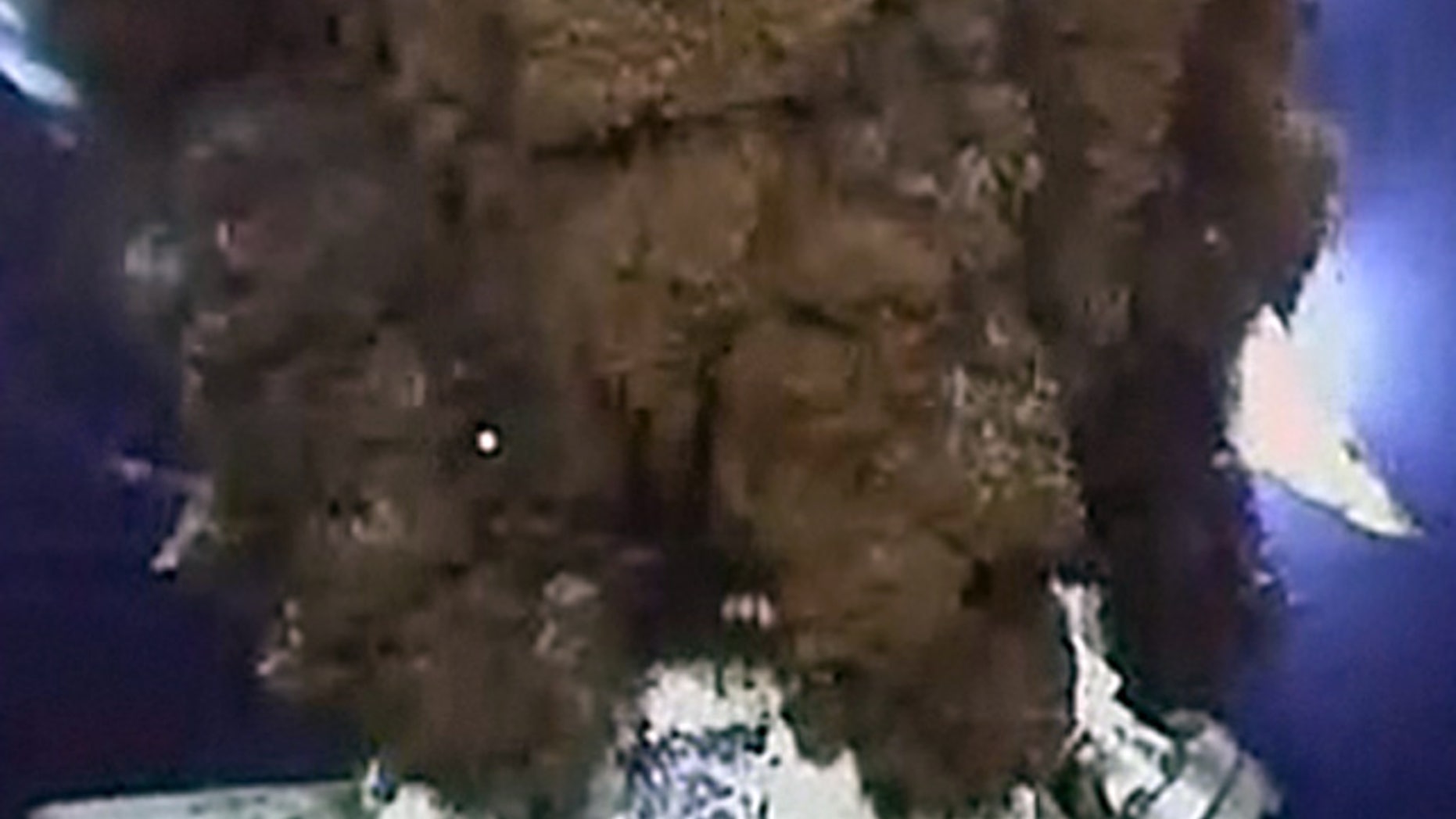 June 4: Oil is seen gushing around the cap placed by BP during efforts to contain the Deepwater Horizon leak in the Gulf.