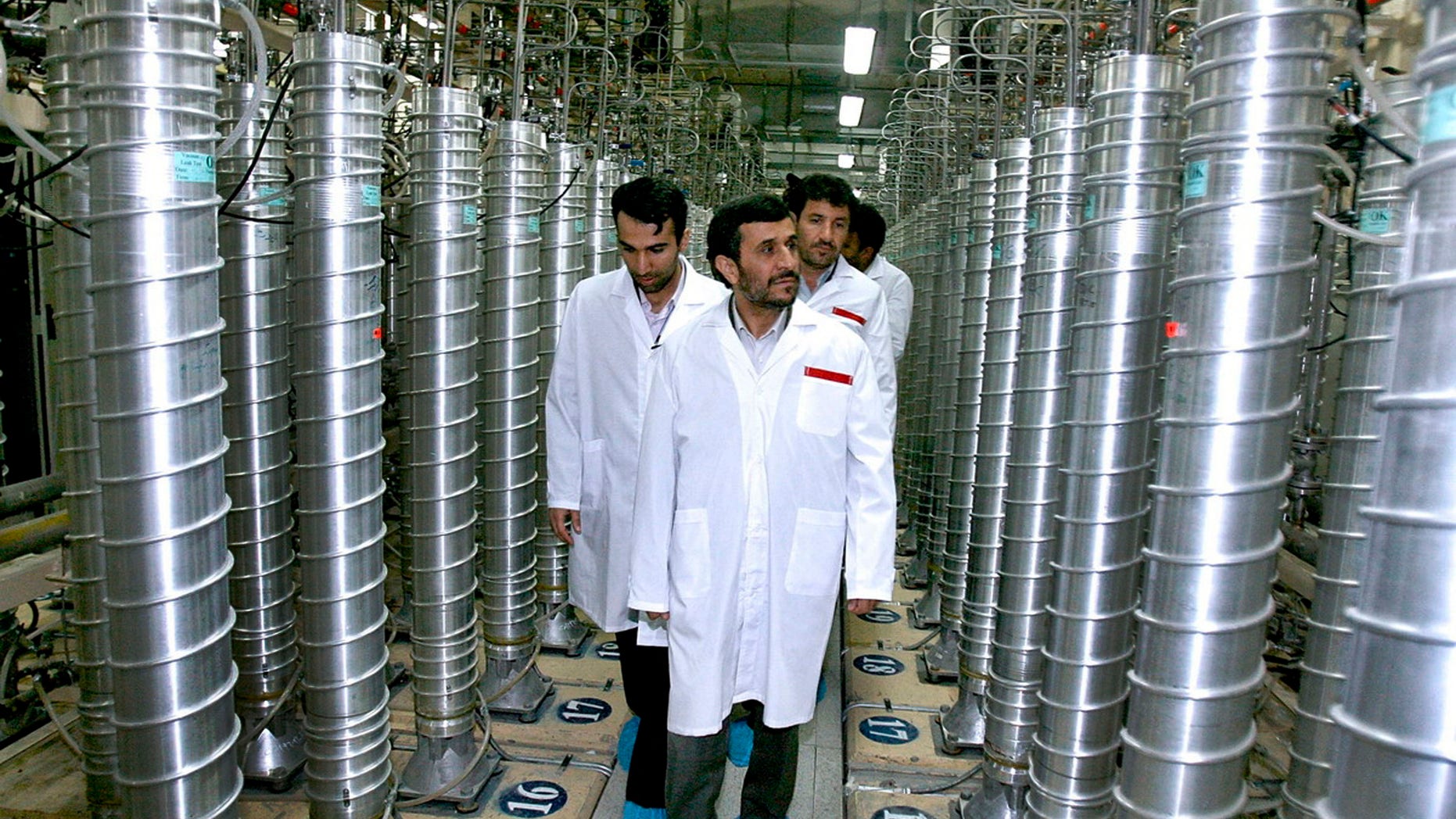 April 8, 2008: Iranian President Mahmoud Ahmadinejad, center, visits the Natanz Uranium Enrichment Facility some 200 miles (322 kilometers) south of the capital Tehran. Iran has begun uranium enrichment at a new underground site well protected from possible airstrikes, a leading hardline newspaper reported.