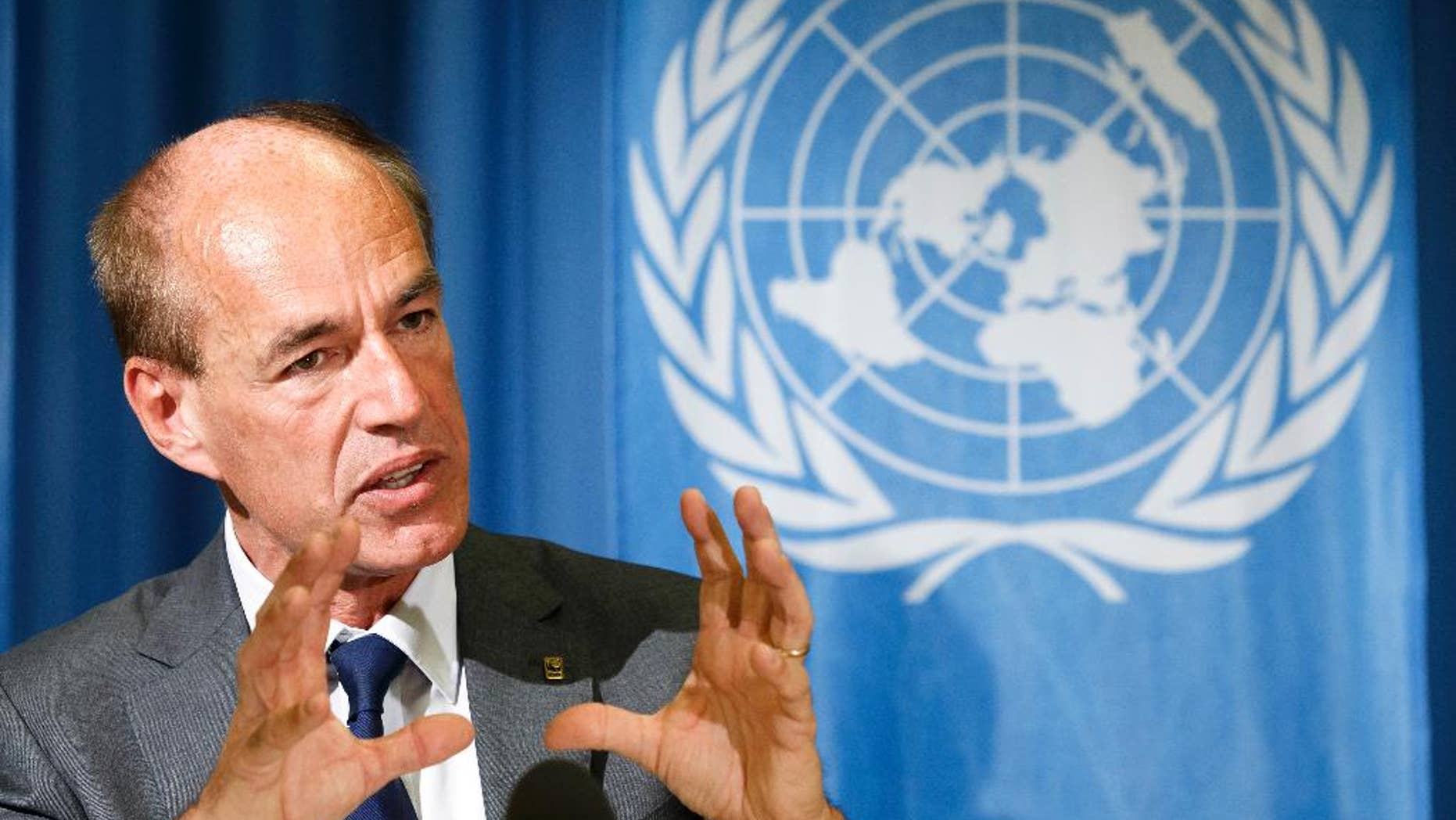 FILE - In this file photo dated Tuesday, Sept. 30, 2014, WWF's Director General Marco Lambertini presents the Living Planet Report 2014 at the European headquarters of the United Nations in Geneva, Switzerland, Tuesday, Sept. 30, 2014. The director-general of the WWF, Lambertini said Tuesday April 12, 2016, said WWF hopes to “capitalize” on the momentum of growing public awareness about world wide conservation, while substantially reducing the number of workers at its Swiss headquarters. (Salvatore Di Nolfi/Keystone via AP, FILE)