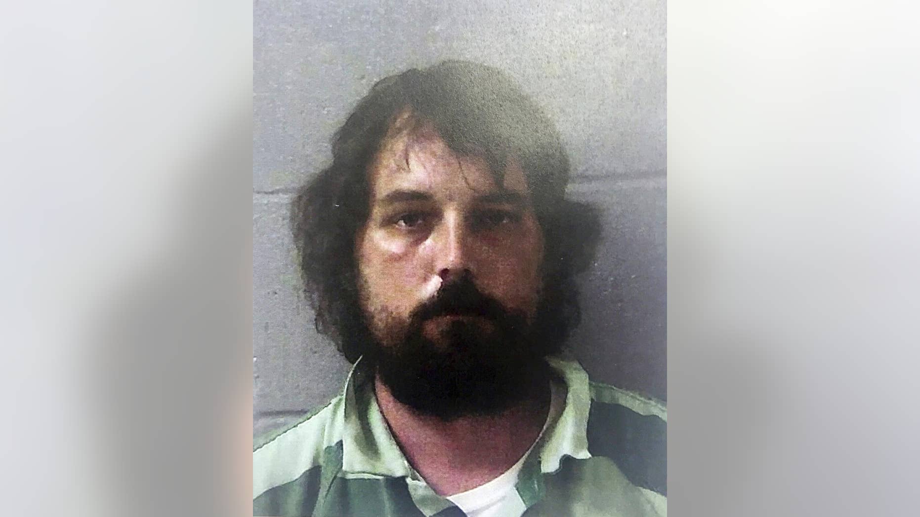 FILE - This Feb 22, 2017 file photo released by the Georgia Bureau of Investigation shows Ryan Alexander Duke, in Georgia. Duke was charged with murder Feb. 23 in the slaying of Tara Grinstead, an Irwin County High School teacher who disappeared in 2005. Tifton Judicial Circuit District Attorney Paul Bowden says a grand jury on Wednesday, April 12, 2017, indicted Ryan Alexander Duke on charges including murder and concealing a death, in Grinstead's death. (Georgia Bureau of Investigation via AP)