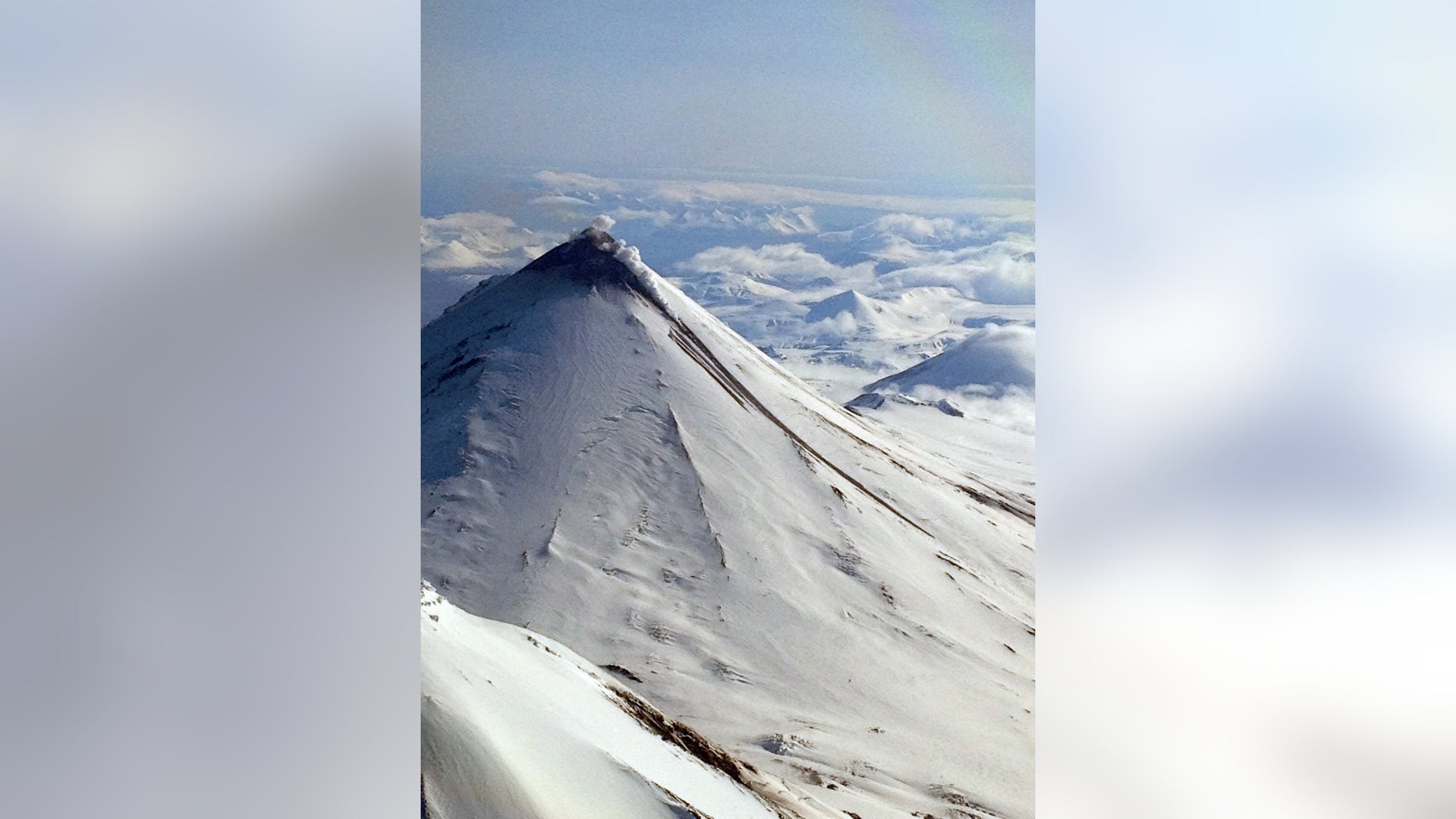 A photo made by Brandon Wilson and provided by the Alaska Volcano Observatory shows steam and the fresh lava flow on the north side of the volcano late Monday, May 13, 2013 in Alaska. Pavlof is the second Alaska volcano to erupt this month. (AP Photo/Brandon Wilson)
