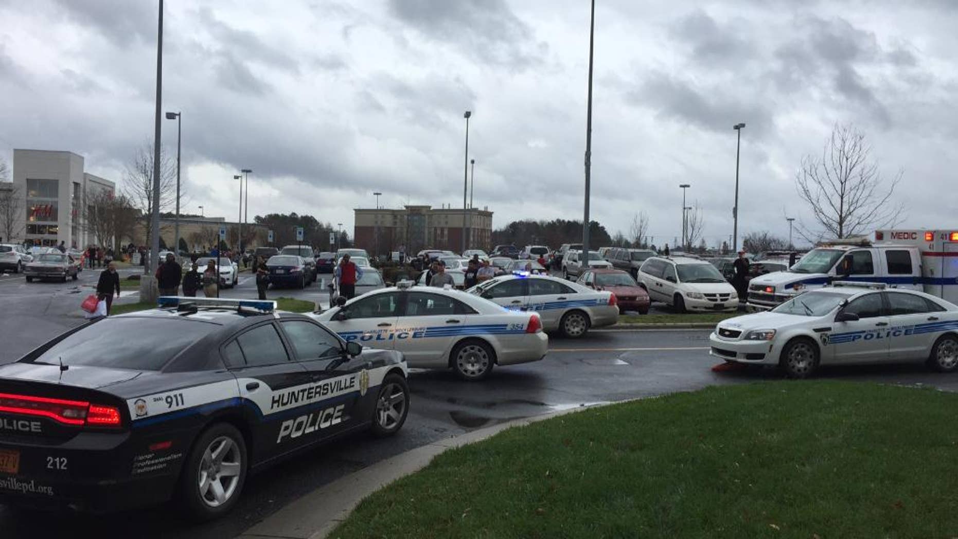 Authorities respond to the scene of a shooting at the Northlake Mall in Charlotte, N.C., Thursday, Dec. 24, 2015. (AP Photo/Steve Reed)