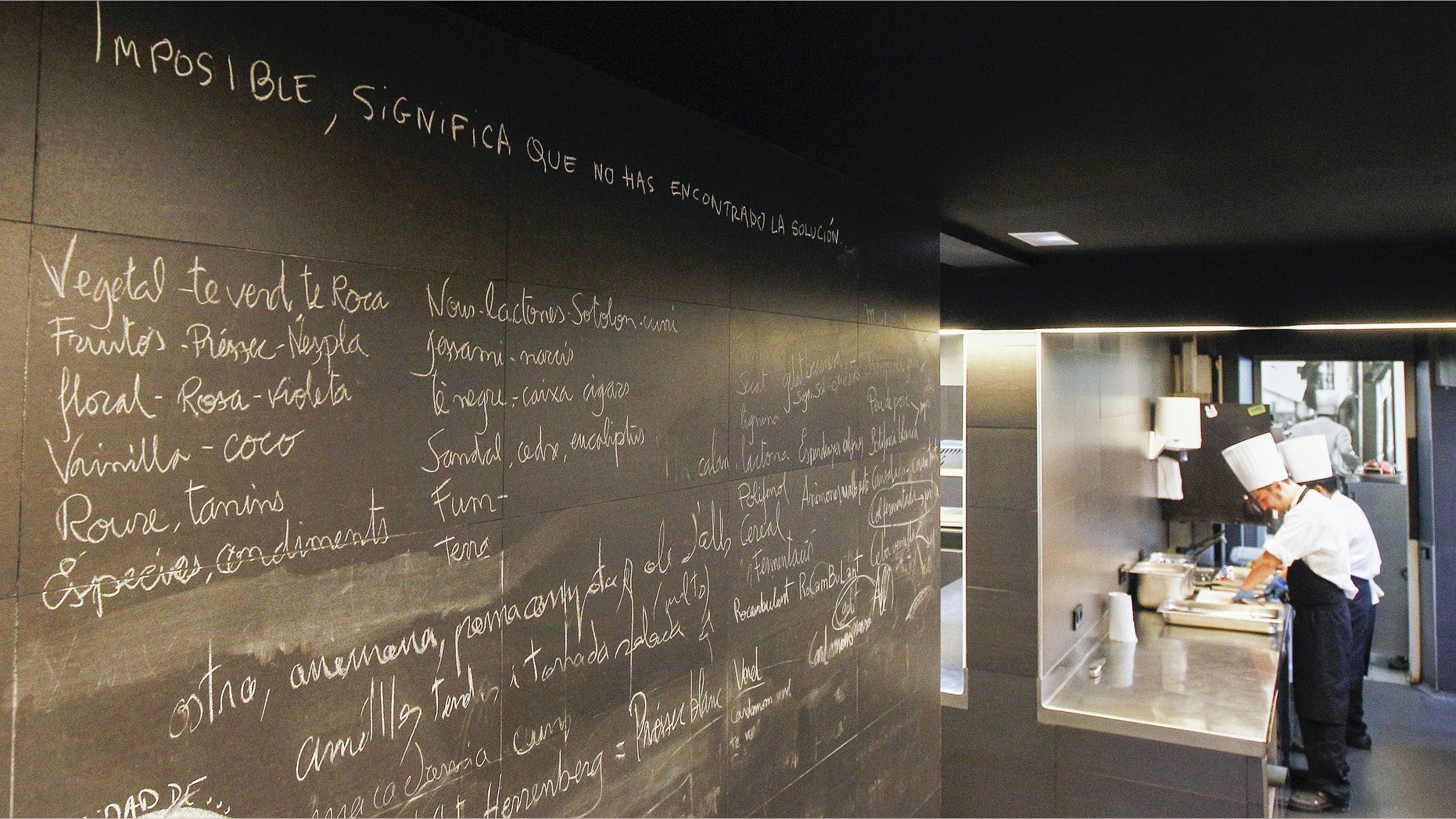 A blackboard of the restaurant "El Celler de Can Roca" reads "Impossible, means that you didn't find the solution" past employees working in the kitchen in Girona on June 2, 2015. Spain's "El Celler de Can Roca" was crowned the world's best restaurant on June 1, 2015 winning praise for the "collective genius" of the three brothers who run it. It was the second time the Girona eatery has topped the World's 50 Best Restaurant awards in London, after taking the number one spot in 2013. AFP PHOTO/ QUIQUE GARCIA (Photo credit should read QUIQUE GARCIA/AFP/Getty Images)