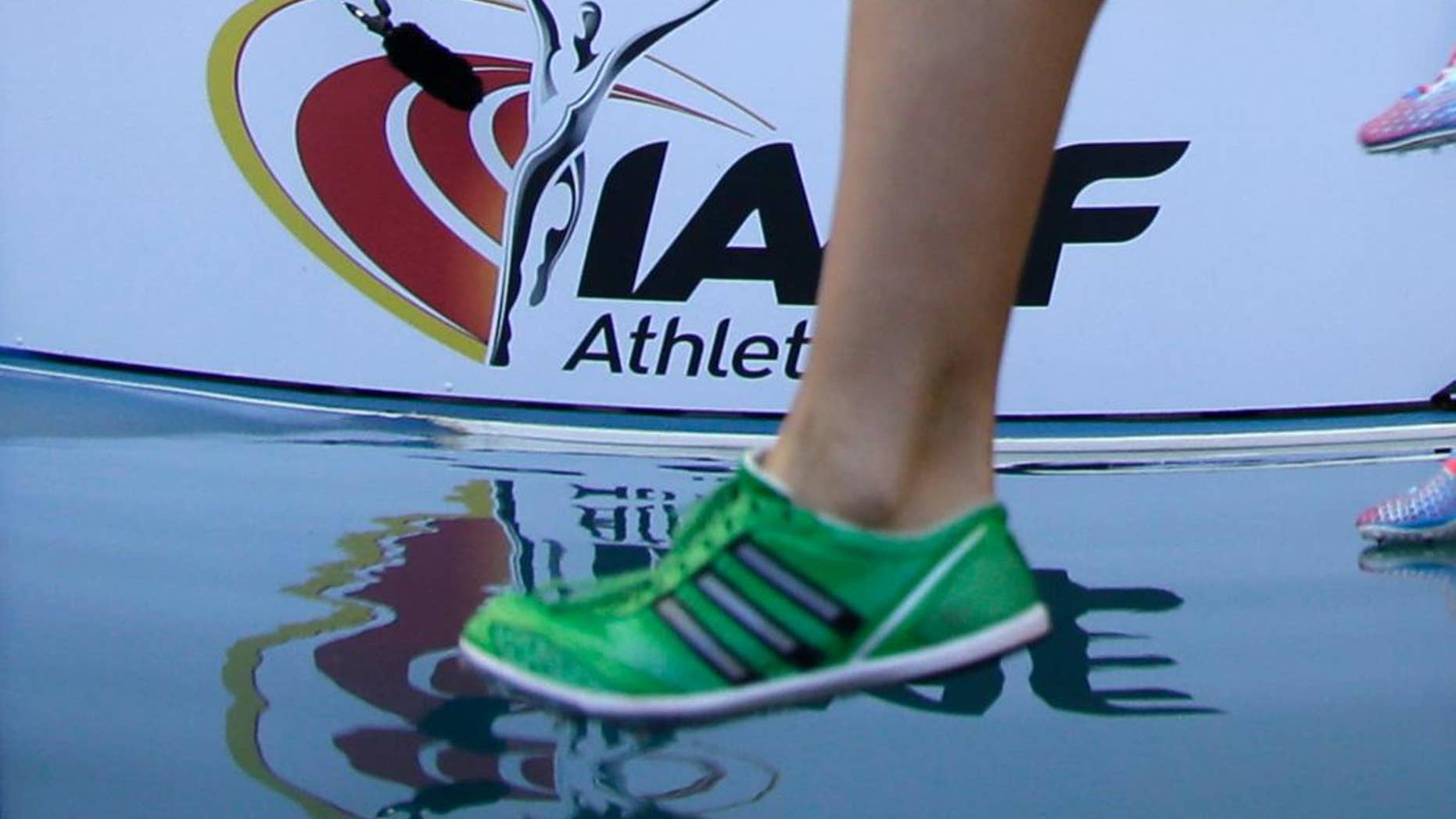 FILE - In this Aug. 10, 2013 file photo athletes compete in a women's 3000-meter steeplechase heat at the World Athletics Championships in the Luzhniki stadium in Moscow, Russia. The credibility of the IAAF and sports in Russia will be on the line Monday, Nov. 9, 2015 when a report on extortion and doping cover-ups is published. (AP Photo/David J. Phillip)
