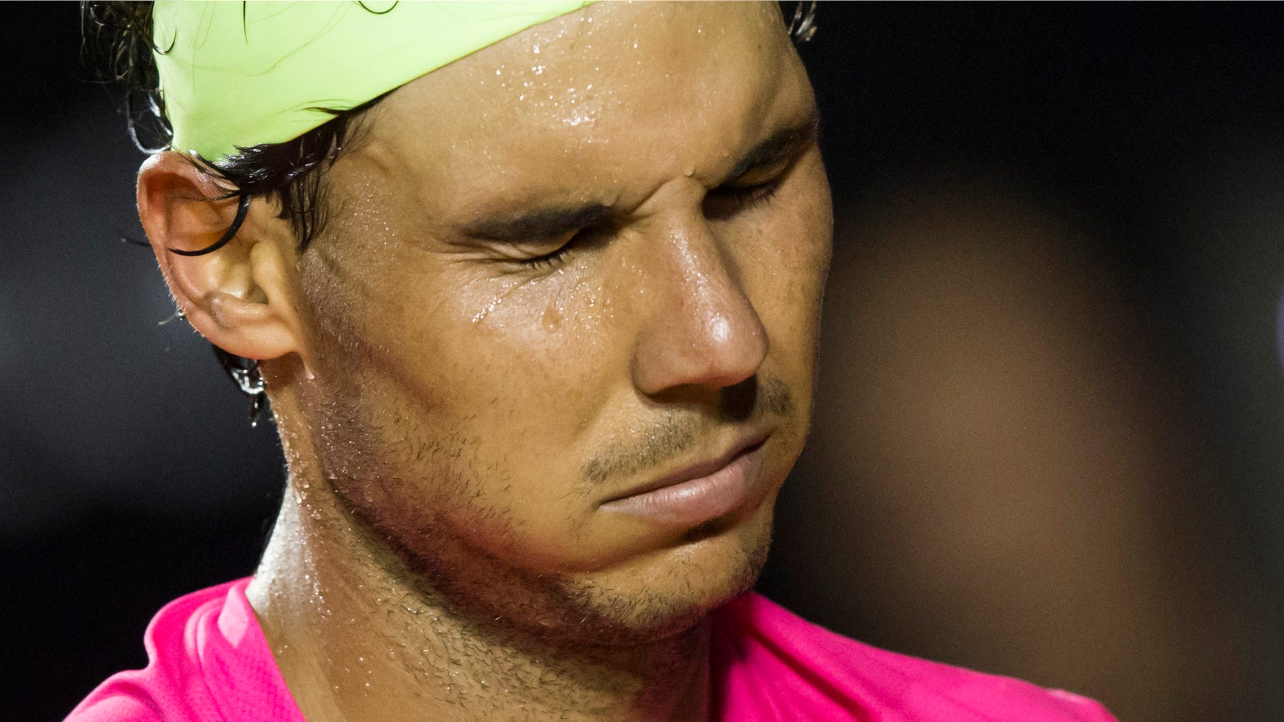 Rafael Nadal, of Spain, reacts after missing a play against Fabio Fognini of Italy during the semifinals of the Rio Open tennis tournament in Rio de Janeiro, Brazil, Saturday, Feb. 21, 2015. (AP Photo/Felipe Dana)