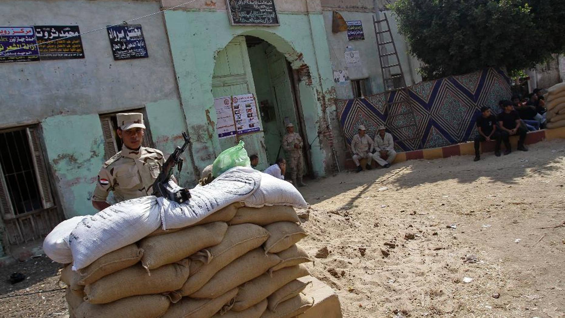 May 26, 2014: An Egyptian soldier stands guard at a polling center of a presidential election that comes nearly a year after the military's ouster of the nation's first freely elected president, the Islamist Mohammed Morsi, in his homeland al-Adwa village near Zagazig, 63 miles northeast of Cairo, Egypt.