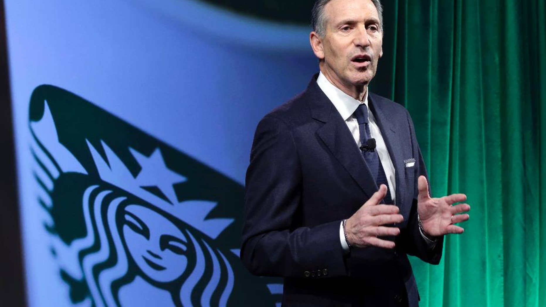 FILE- In this Dec. 7, 2016, file photo, Starbucks Chairman and CEO Howard Schultz speaks during the Starbucks 2016 Investor Day meeting in New York. Starbucks says it will hire 10,000 refugees over the next five years, a response to President Donald Trump's indefinite suspension of Syrian refugees and temporary travel bans that apply to six other Muslim-majority nations. Schultz said in a letter to employees Sunday, Jan. 29, 2017, that the hiring would apply to stores worldwide. (AP Photo/Richard Drew, File)