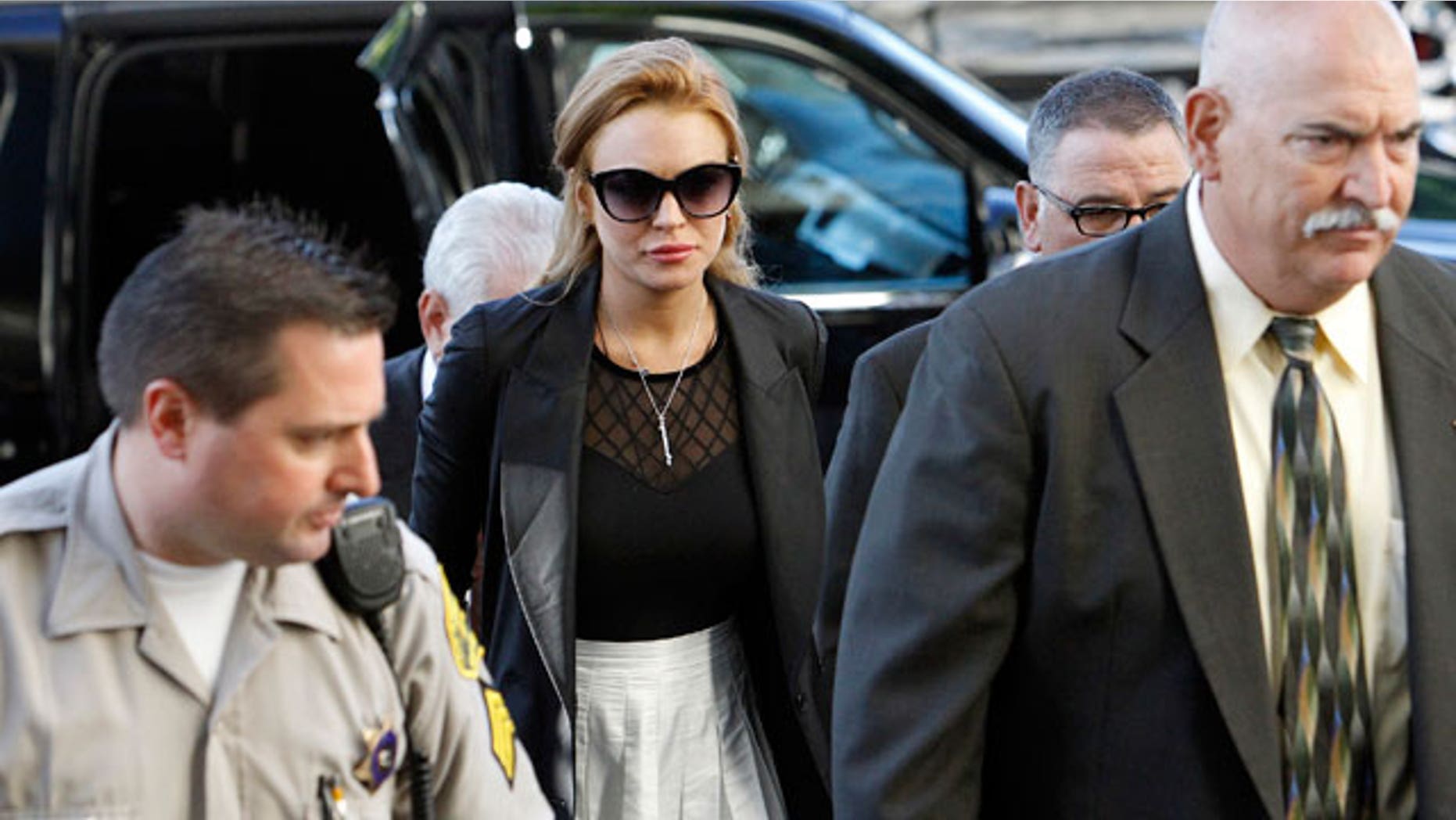 Sept. 24: Lindsay Lohan arrives at a court hearing in Los Angeles after failing a court-mandated drug test. She will now appear in a biopic about John Gotti.