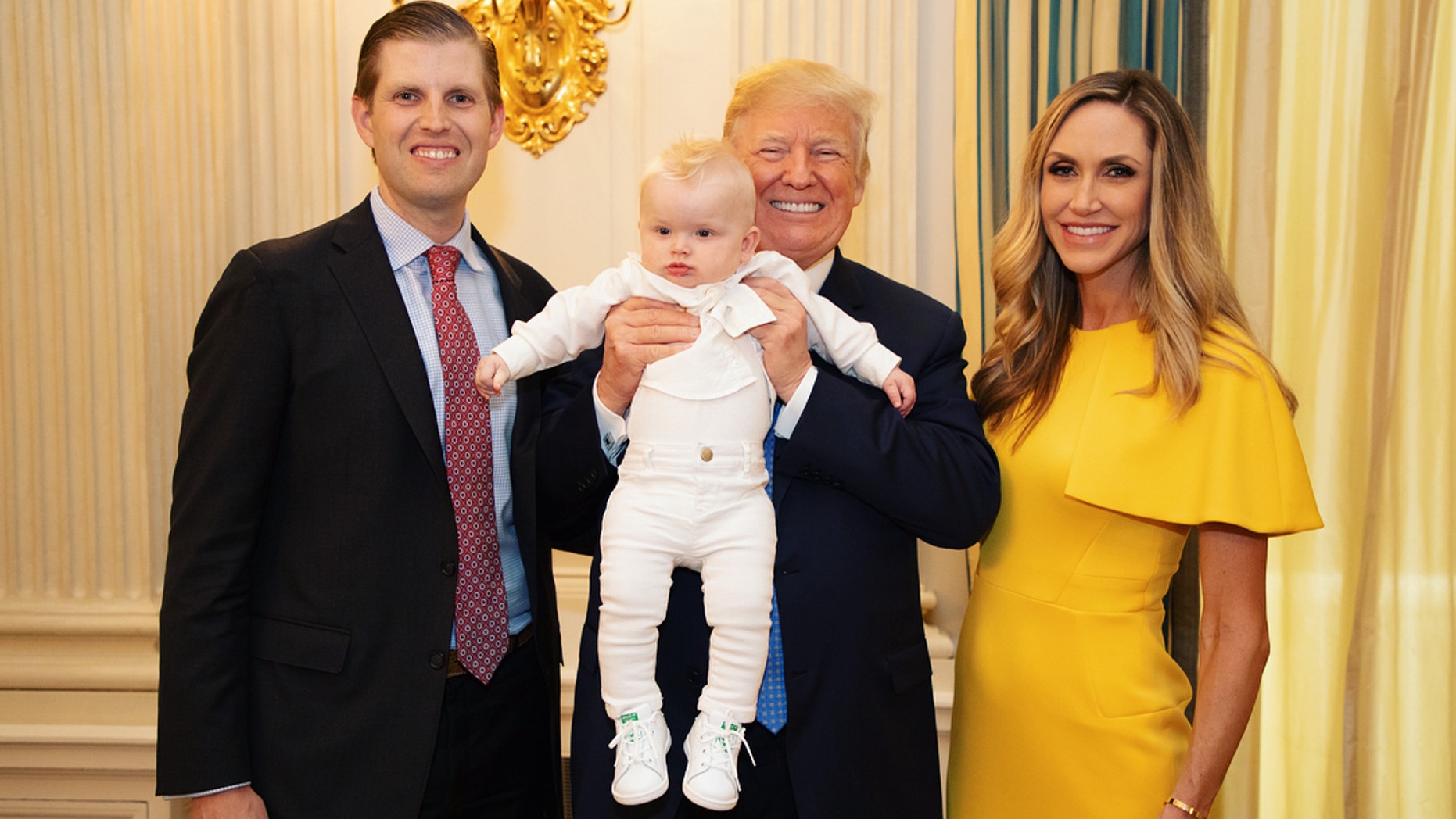 Lara Trump is seen here with her husband Eric Trump, son Luke, and her father-in-law, President Donald Trump.