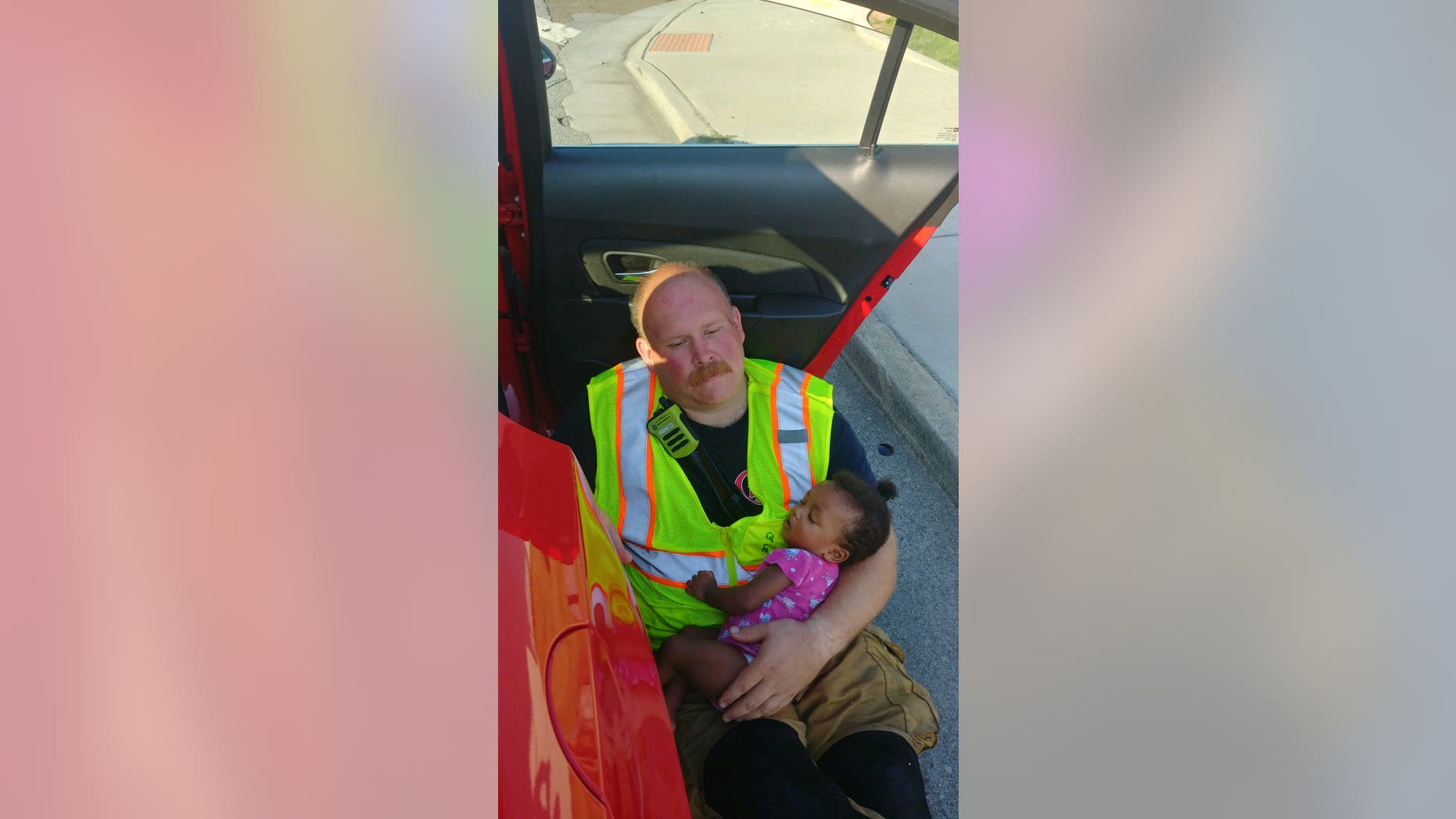 A photo of Capt. Chris Blazek, of the Chattanooga Fire Department, cradling a baby after she was in a car accident on State Route 58 has gone viral since the department posted it to Facebook Monday.