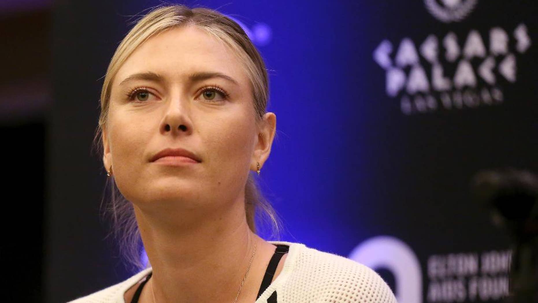 FILE - In this Monday, Oct. 10, 2016 file photo, Maria Sharapova speaks to members of the media prior to a World Team Tennis exhibition in Las Vegas, U.S. Sharapova will return from her 15-month doping ban at a tournament in Germany in April. (AP Photo/Isaac Brekken, file)
