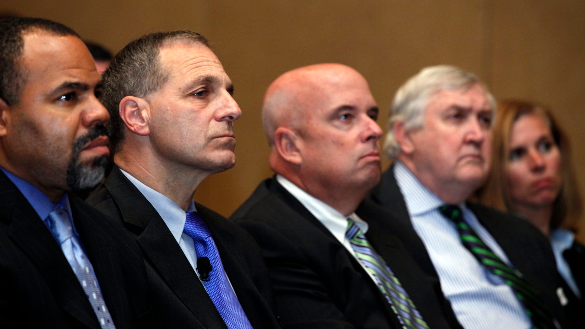 November 21: Former FBI director Louis Freeh, second from left, listens during a press availability to announce he will lead an independent investigation into allegations of child abuse by a former Penn State employee.