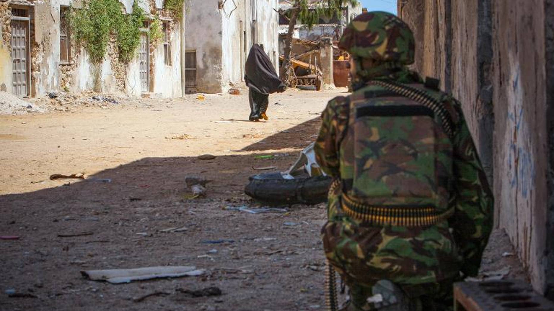 A Kenyan soldier serving with the African Union Mission in Somalia keeps watch on a street in the southern Somali port city of Kismayo on October 5, 2012, in a photo released by the African Union-United Nations Information Support Team