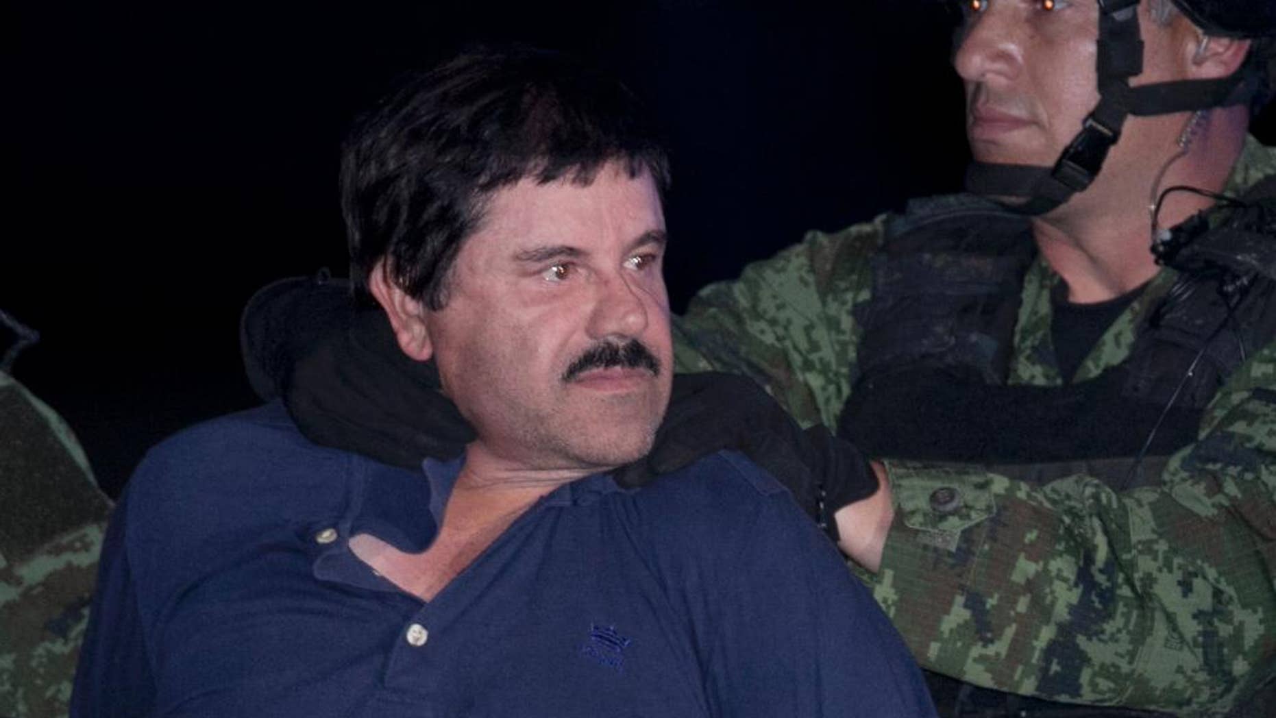 FILE - In this Jan. 8, 2016 file photo, Joaquin "El Chapo" Guzman is made to face the press as he is escorted to a helicopter in handcuffs by Mexican soldiers and marines at a federal hangar in Mexico City, Mexico. Mexico’s Foreign Relations department has ruled that the extradition of Guzman to the United States can go forward. The department said Friday, May 20, 2016 that the U.S. had guaranteed that Guzman would not face the death penalty, which is not applied in Mexico. The process can be appealed. (AP Photo/Marco Ugarte, File)
