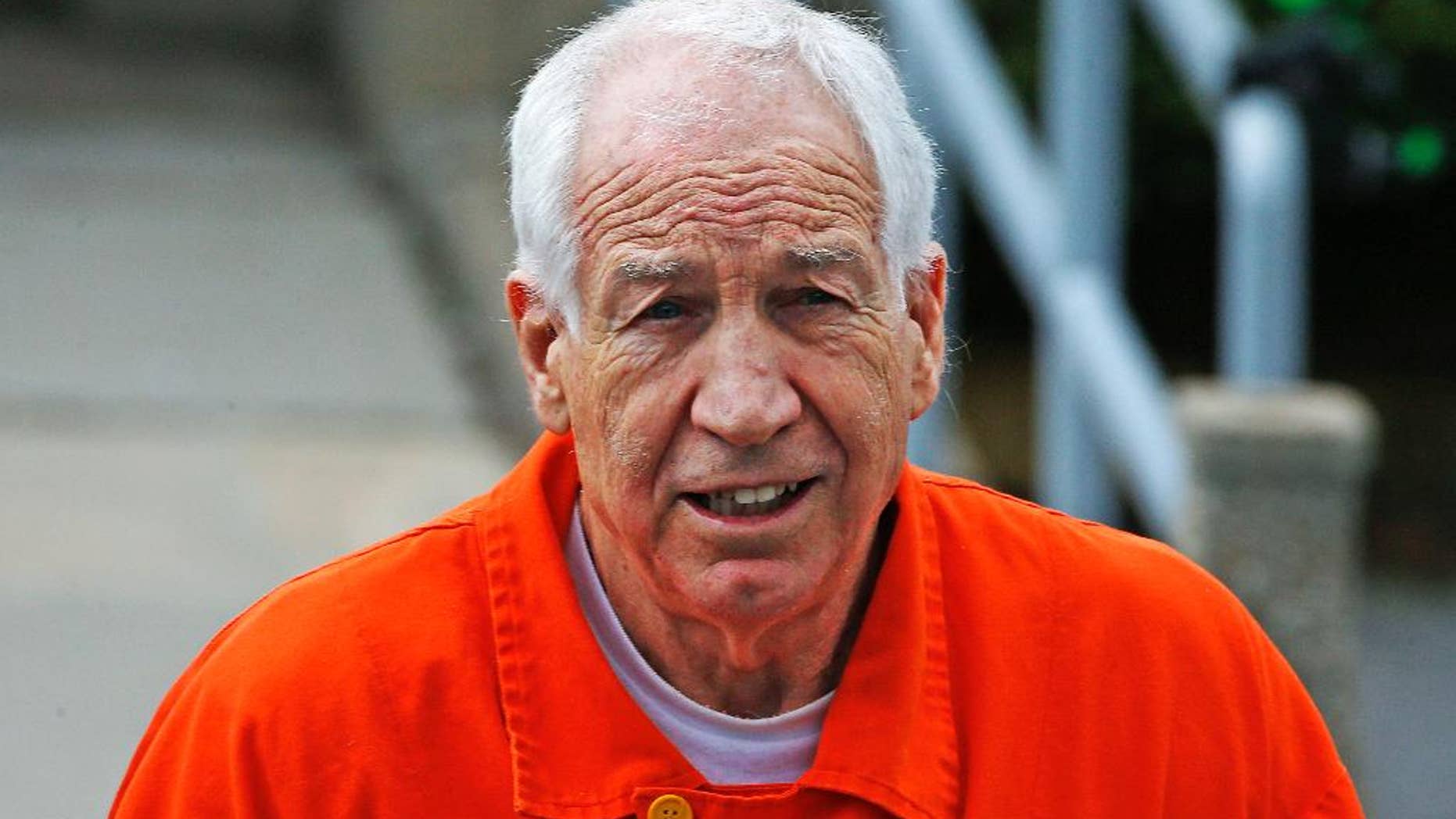 FILE - In this Monday, May 2, 2016, file photo, former Penn State University assistant football coach Jerry Sandusky leaves the Centre County Courthouse after a hearing of arguments on his request for an evidentiary hearing as he seeks a new trial in Bellefonte, Pa. Sandusky has been moved Feb. 27, 2017 from a maximum-security prison to a medium-security facility, State Correctional Institution-Somerset, in western Pennsylvania. (AP Photo/Gene J. Puskar)