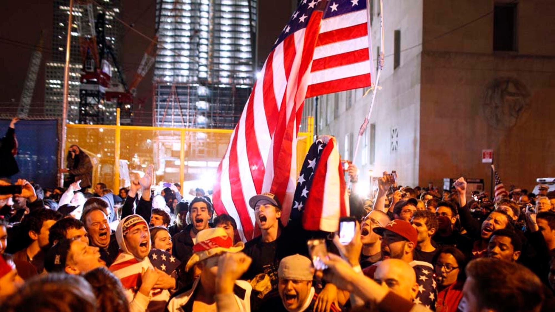 A raucous crowd waves American flags and celebrates the death of Osama bin Laden in 2011.