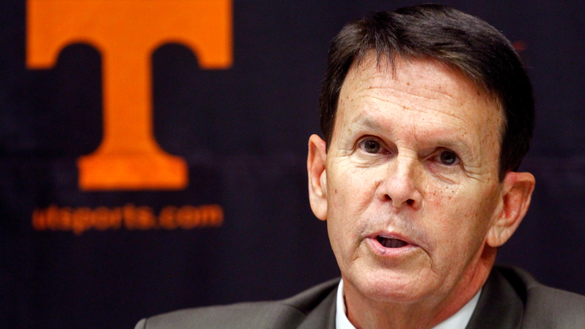FILE - In this Nov. 18, 2012, file photo, Tennessee athletic director Dave Hart speaks to reporters at a news conference in Knoxville, Tenn. Hart said the athletic department is in better financial position now that university officials have addressed the issues that left it with a $3.98 million deficit and the lowest reserves in the SEC last year, but he acknowledged the department isn’t “out of the woods” yet in that regard. (AP Photo/Wade Payne, File)